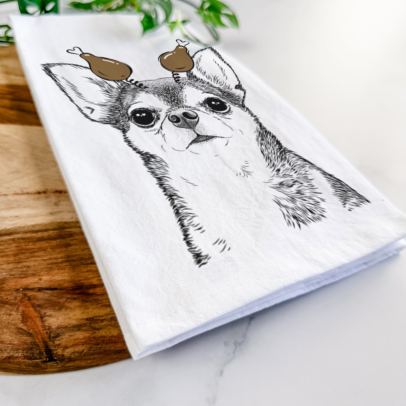 Hand-drawn sketch of Baby the Chihuahua with a Thanksgiving turkey headpiece on a tea towel