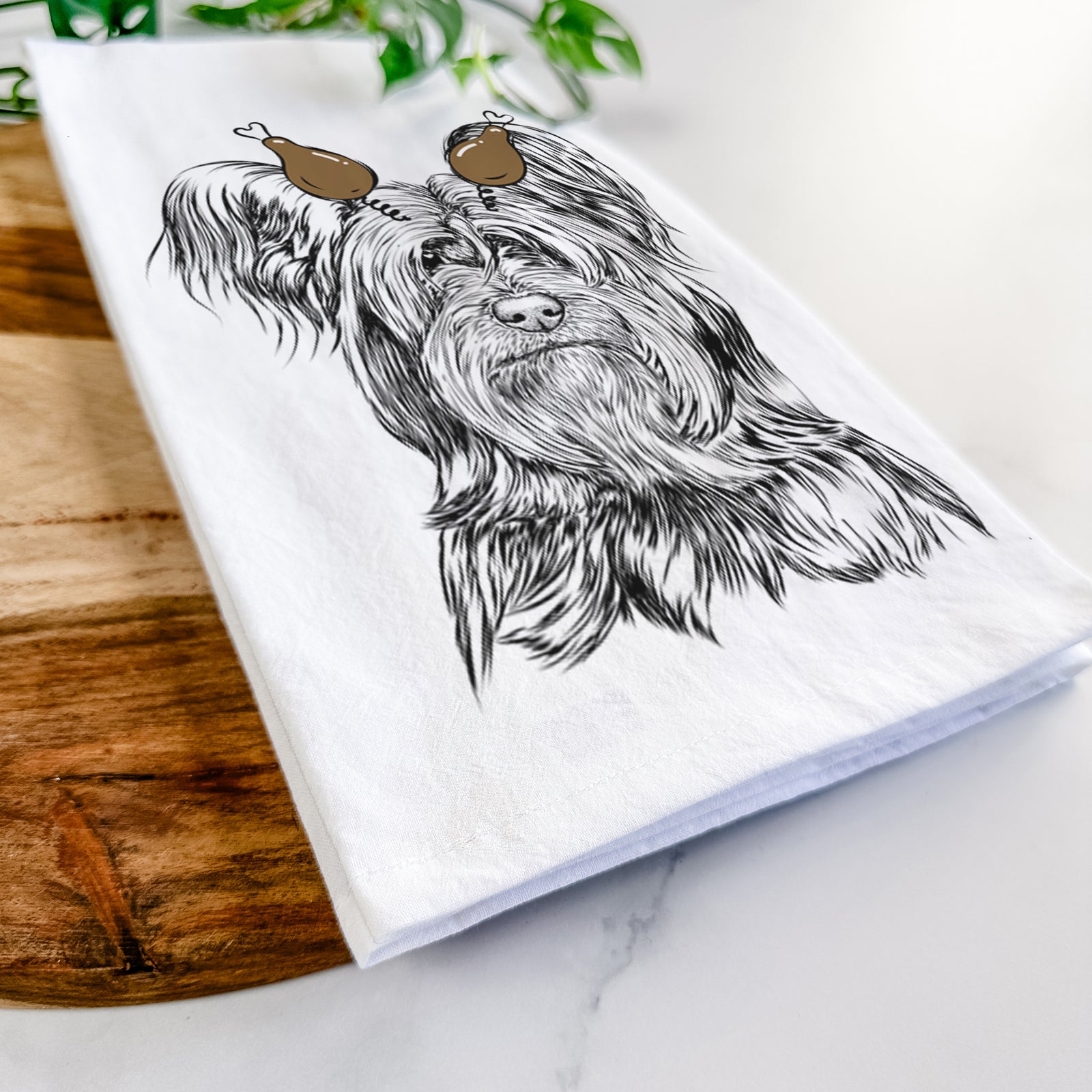 Hand-drawn sketch of Bandit the Skye Terrier with a Thanksgiving turkey headpiece on a tea towel