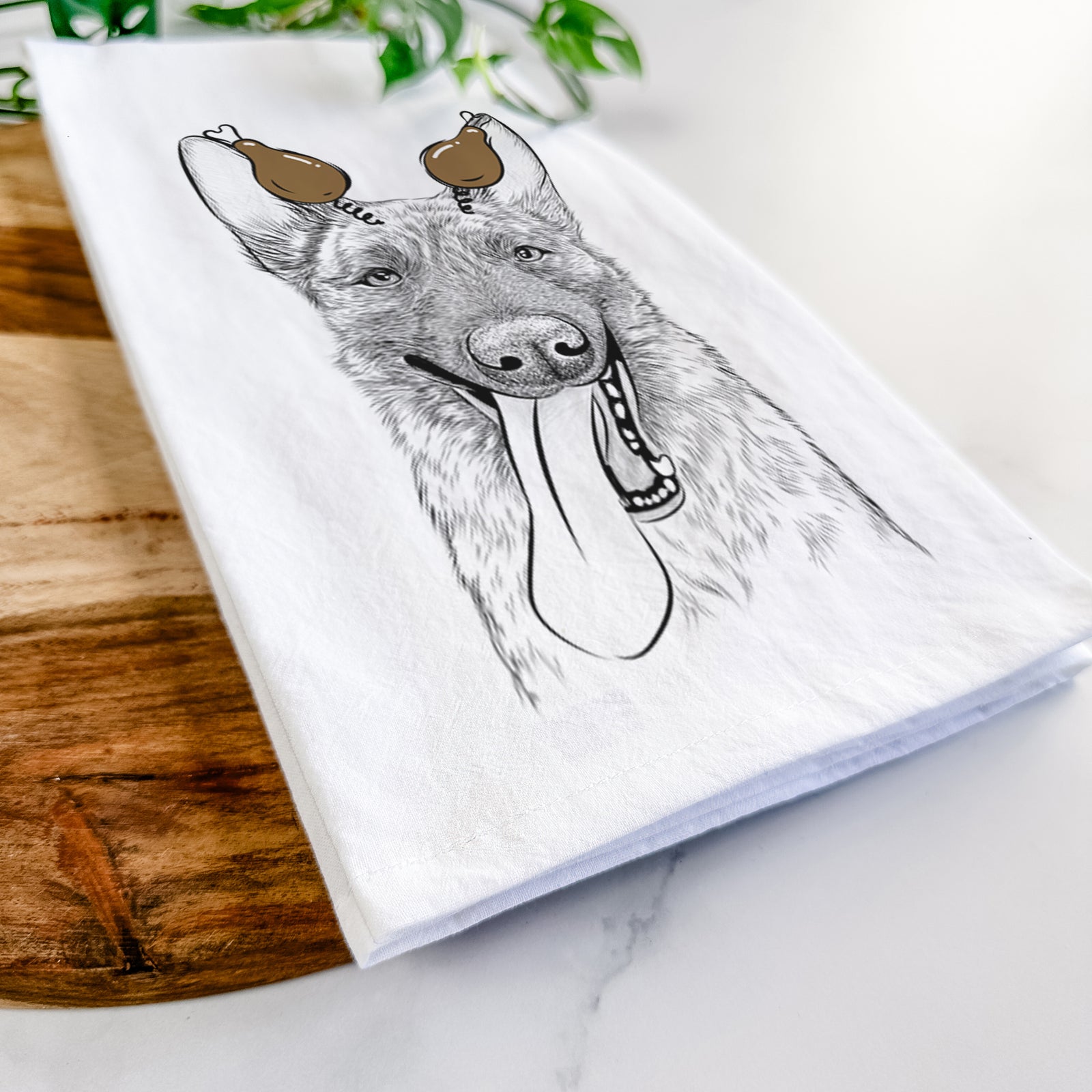 Hand-drawn sketch of Bessa the Dutch Shepherd with a Thanksgiving turkey headpiece on a tea towel