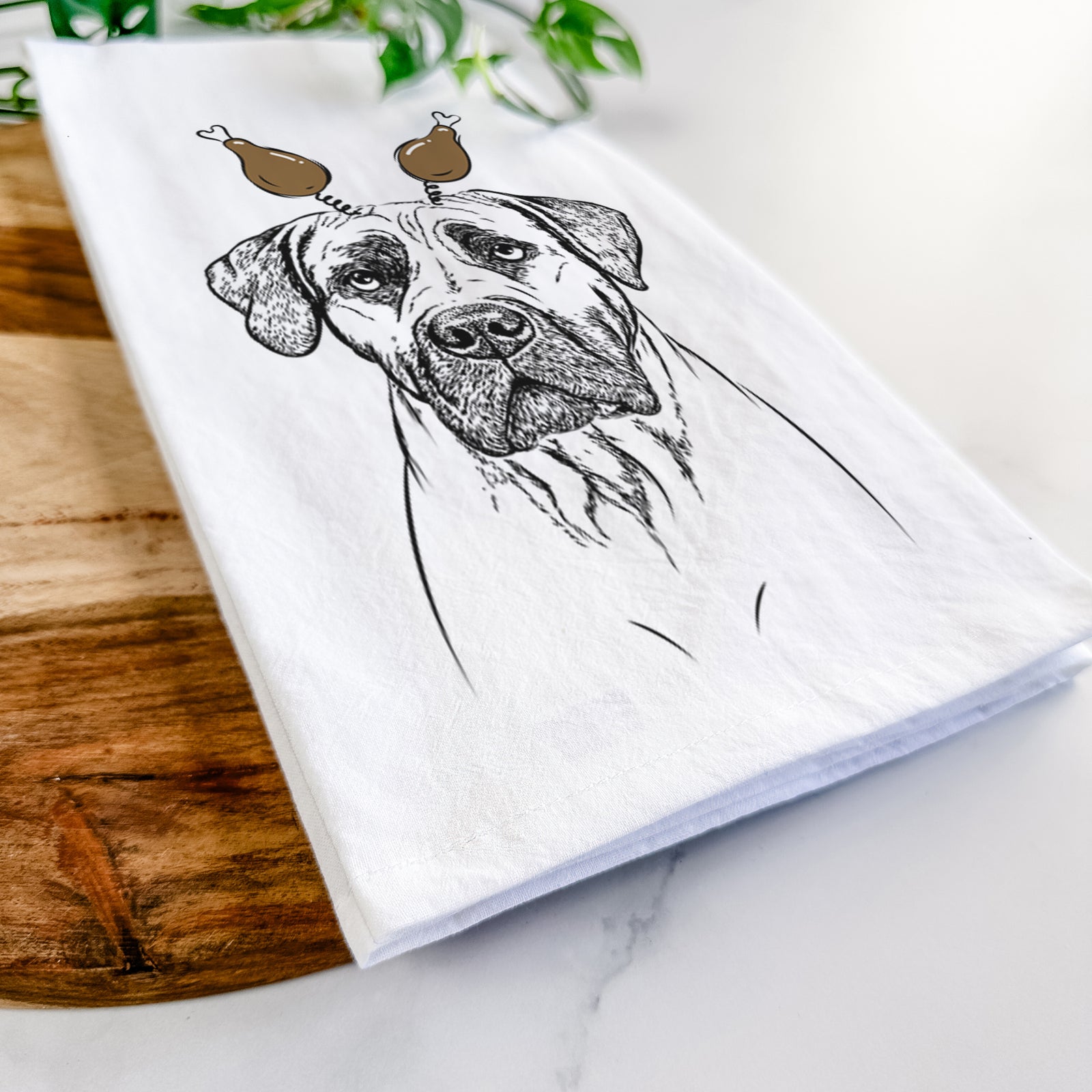 Hand-drawn sketch of Boris the Boerboel with a Thanksgiving turkey headpiece on a tea towel