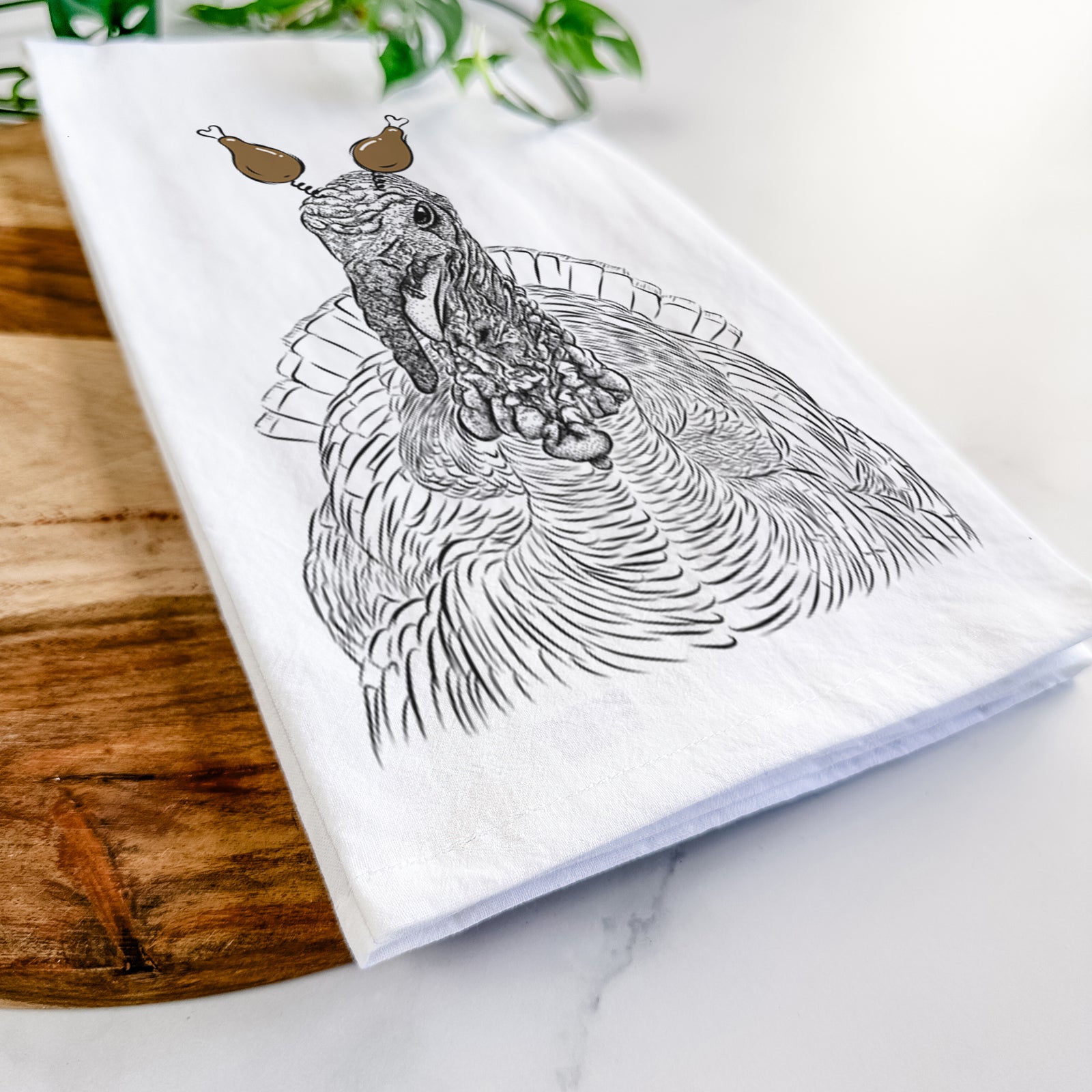 Hand-drawn sketch of Brady the Turkey with a Thanksgiving turkey headpiece on a tea towel