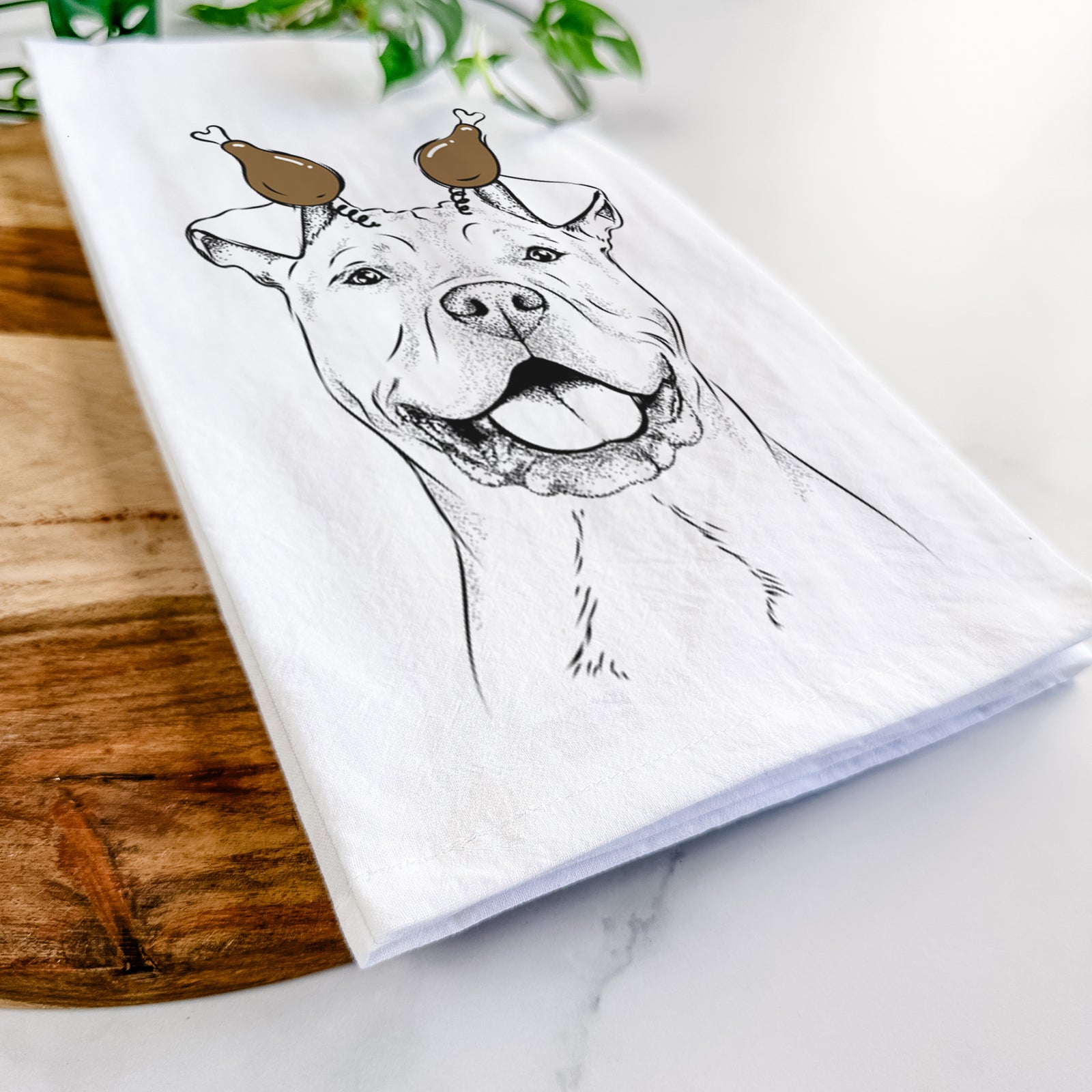 Hand-drawn sketch of Bubba Scraps the American Staffordshire Mix with a Thanksgiving turkey headpiece on a tea towel