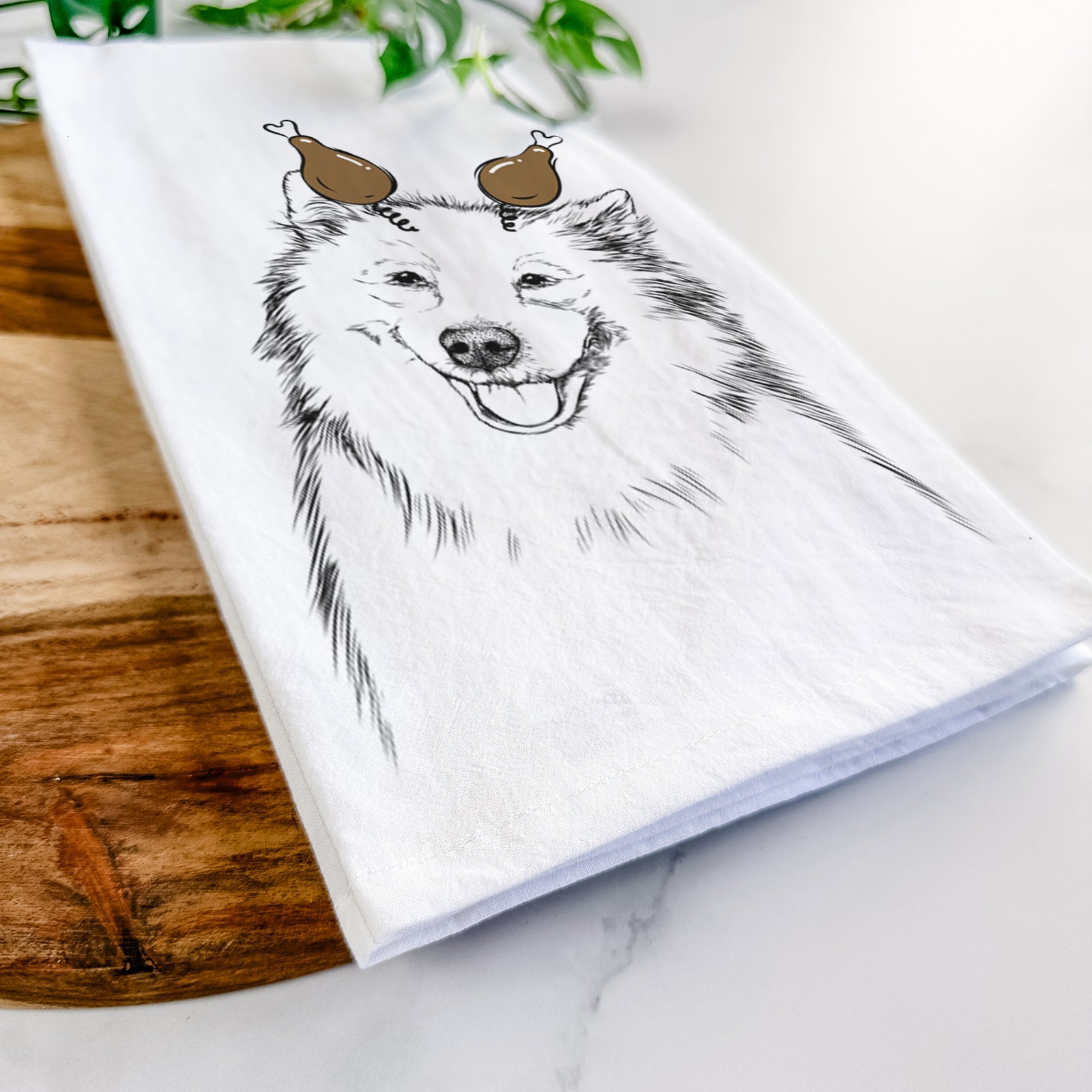 Hand-drawn sketch of Caico the Samoyed with a Thanksgiving turkey headpiece on a tea towel