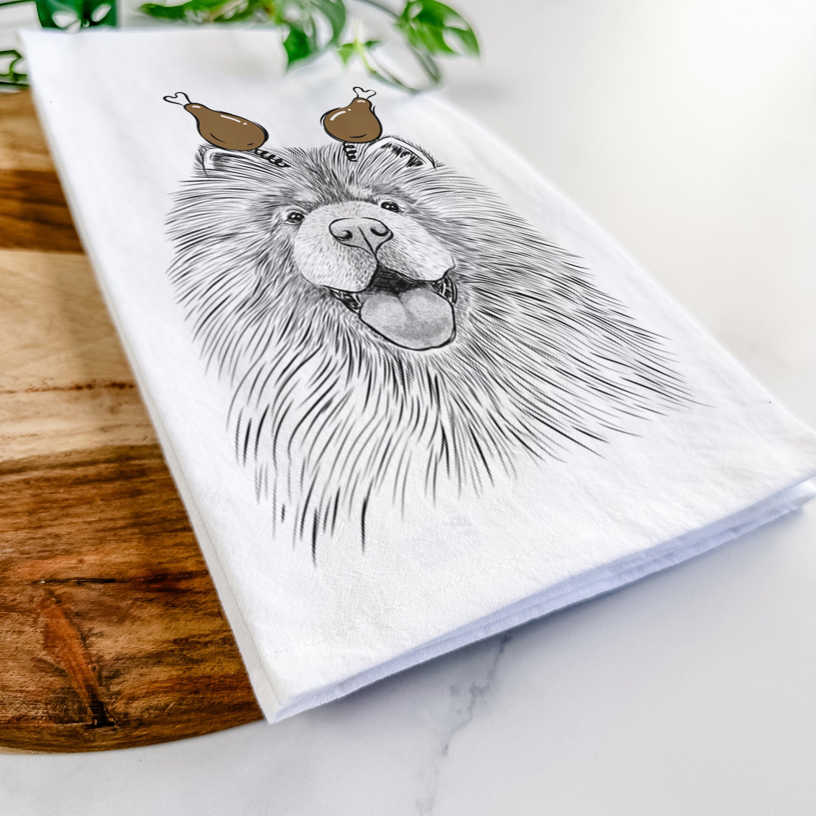 Hand-drawn sketch of Charming Charlie the Chow Chow with a Thanksgiving turkey headpiece on a tea towel