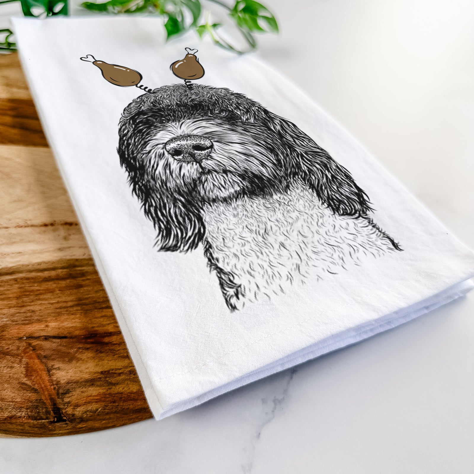 Hand-drawn sketch of Chris the Portuguese Water Dog with a Thanksgiving turkey headpiece on a tea towel
