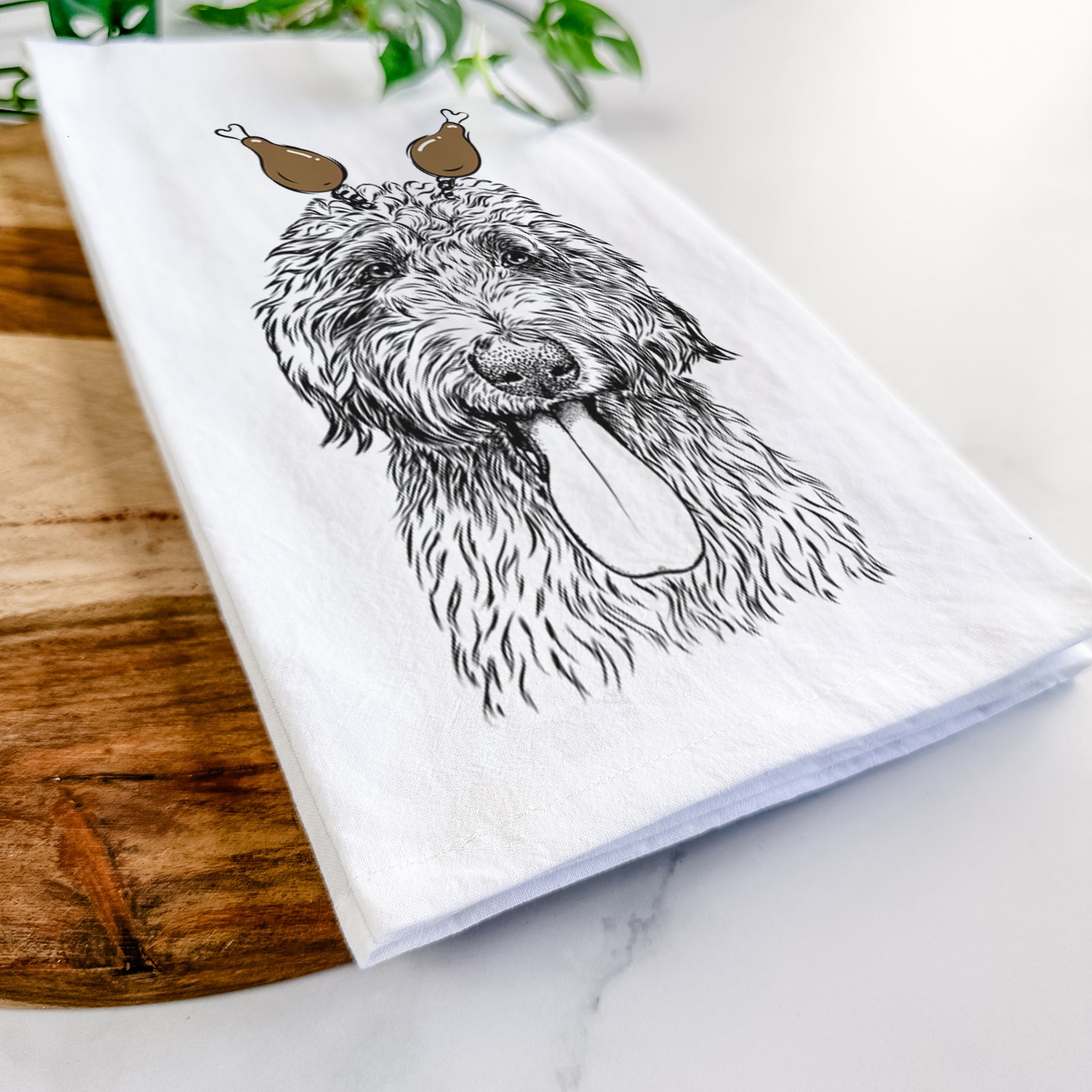 Hand-drawn sketch of CiCi Paulk the Aussiedoodle with a Thanksgiving turkey headpiece on a tea towel