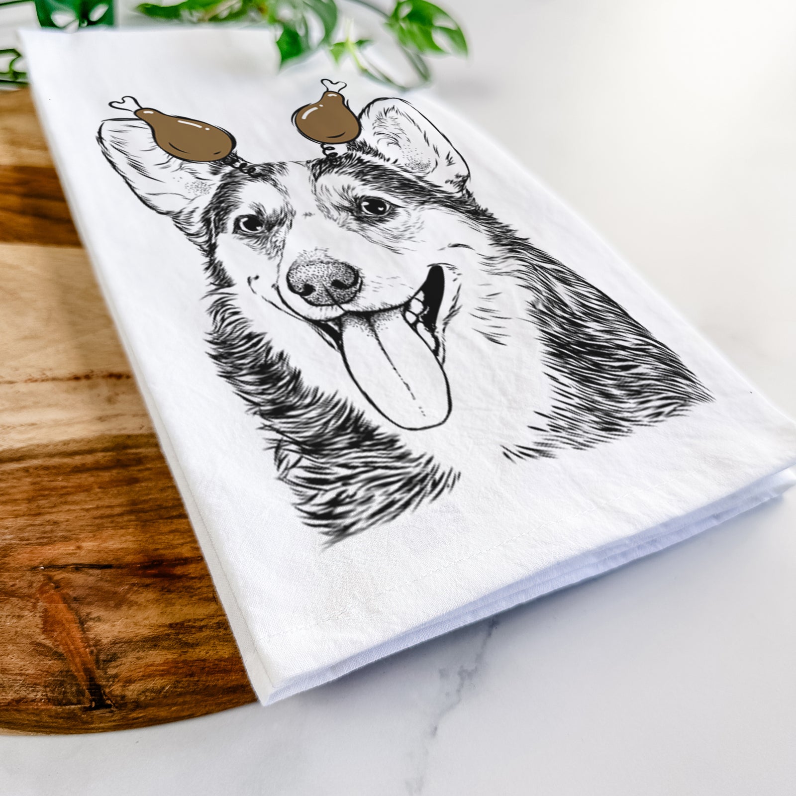 Hand-drawn sketch of Darma the Corgi with a Thanksgiving turkey headpiece on a tea towel