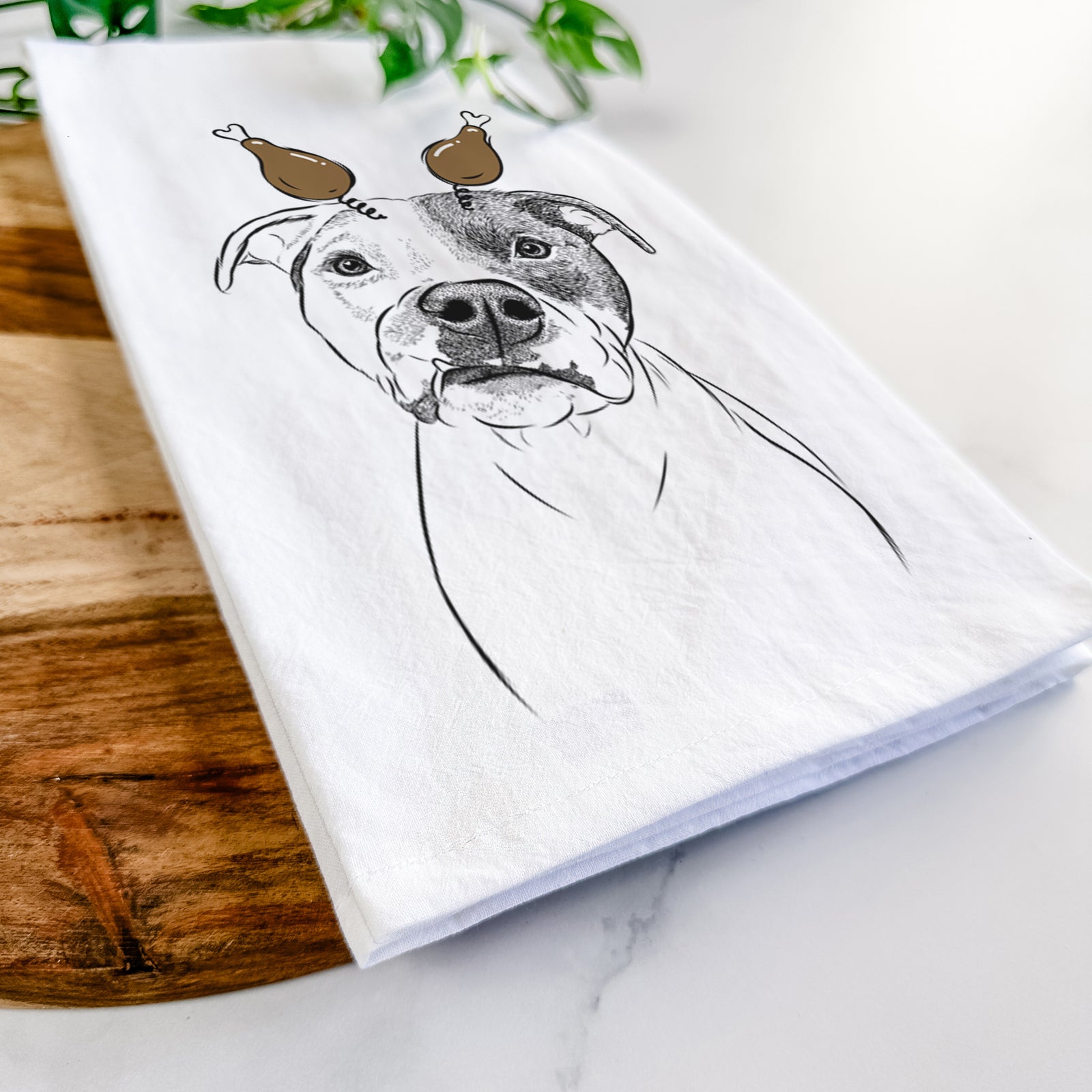 Hand-drawn sketch of Dexter the Pitbull with a Thanksgiving turkey headpiece on a tea towel