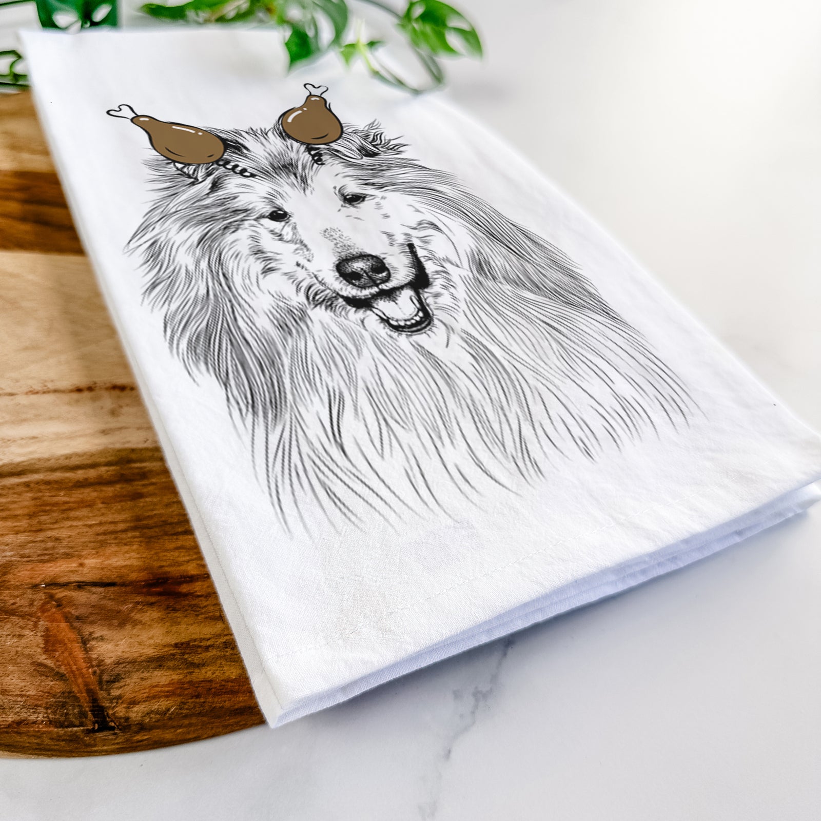 Hand-drawn sketch of Donnan the Rough Collie with a Thanksgiving turkey headpiece on a tea towel