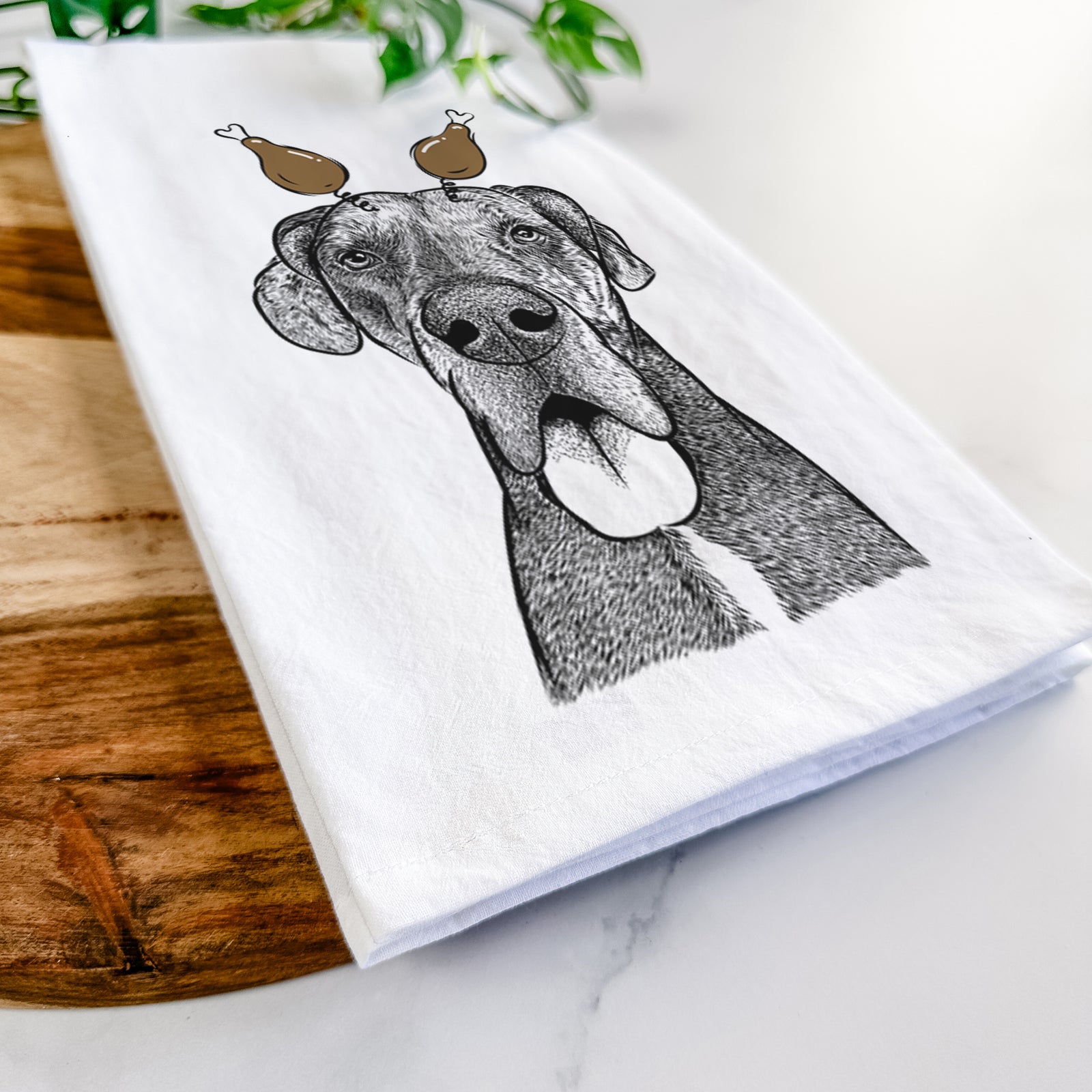 Hand-drawn sketch of Eli the Great Dane with a Thanksgiving turkey headpiece on a tea towel