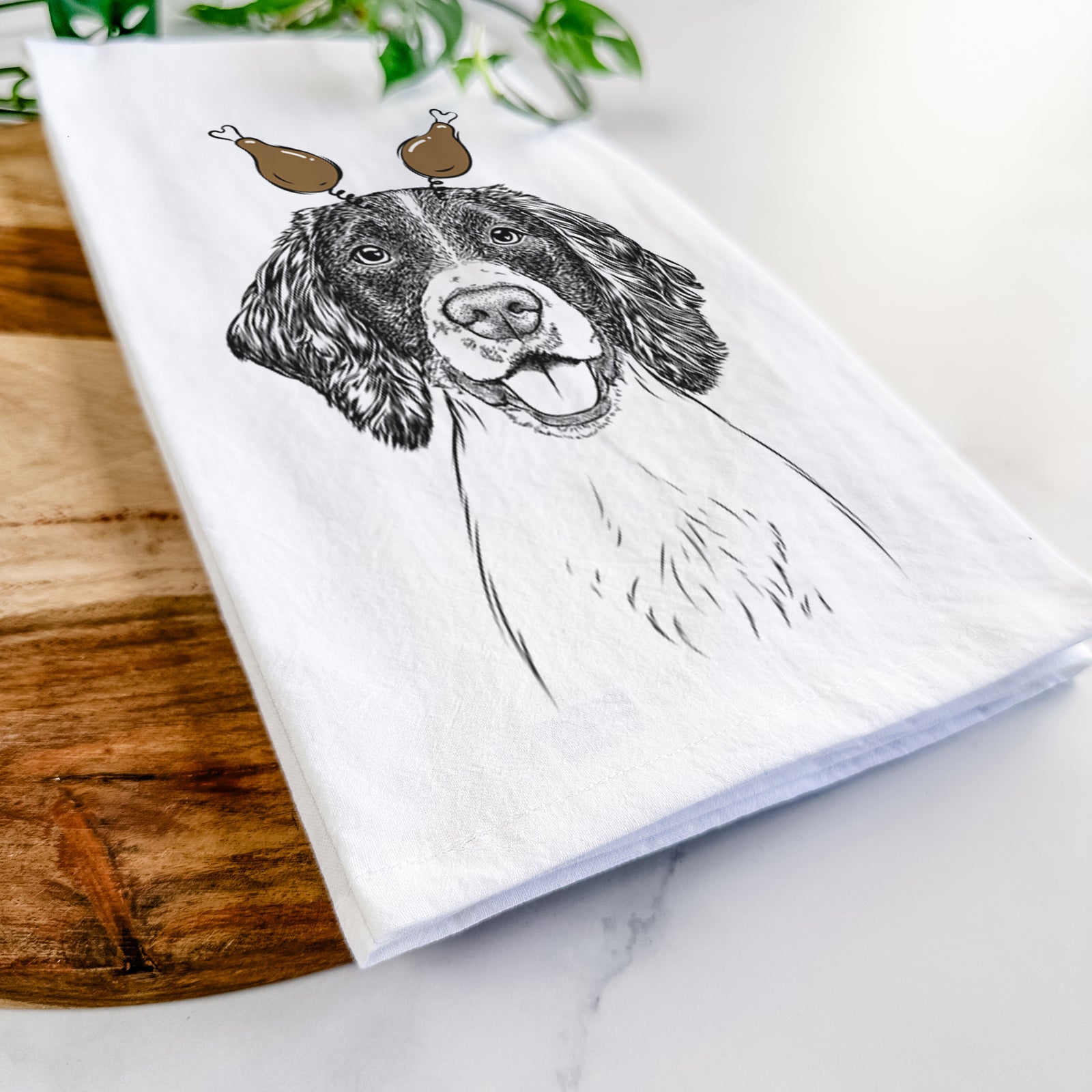 Hand-drawn sketch of Ever the English Springer Spaniel with a Thanksgiving turkey headpiece on a tea towel