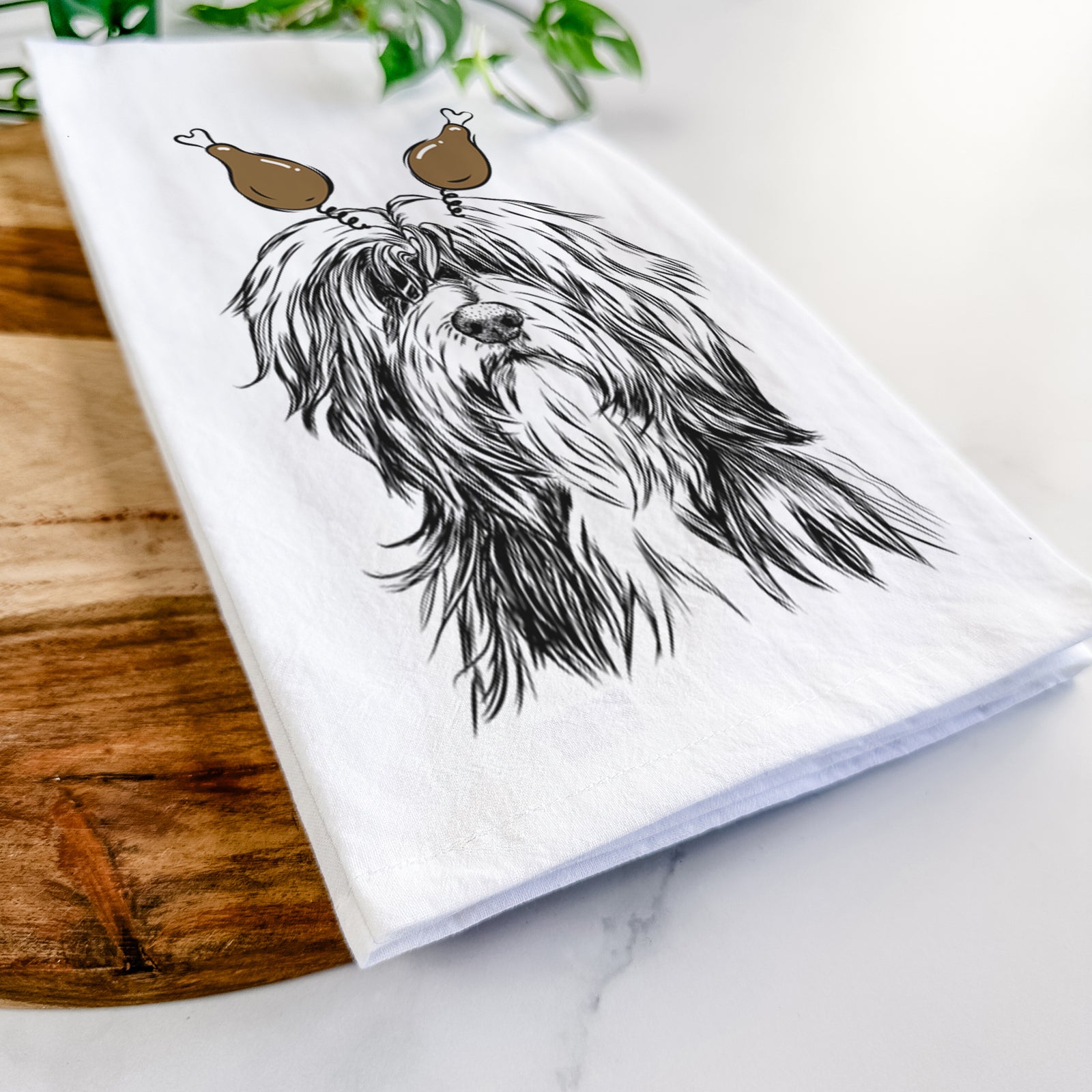 Hand-drawn sketch of Fiji the Polish Lowland Sheepdog with a Thanksgiving turkey headpiece on a tea towel