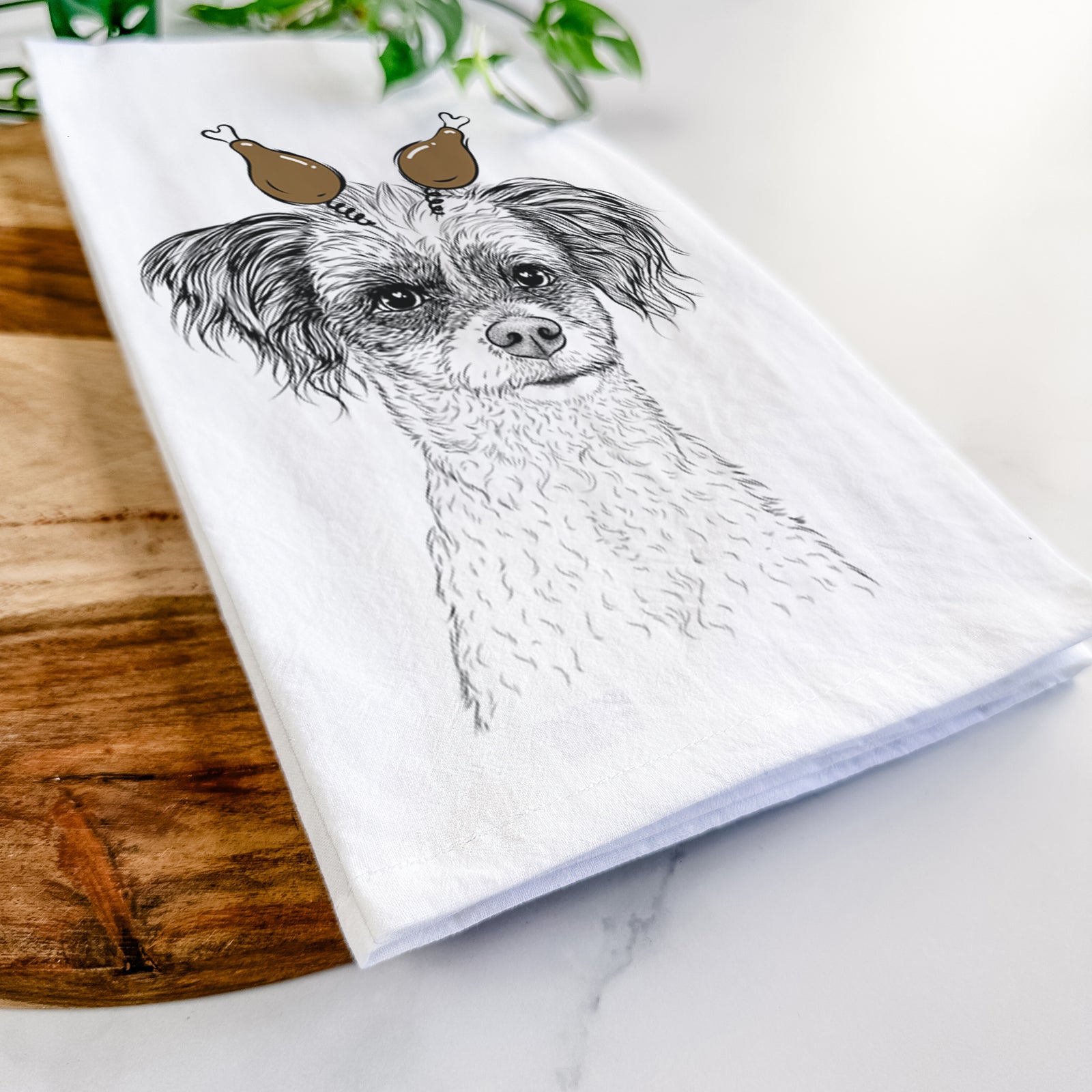 Hand-drawn sketch of Finley the Papillon Mix with a Thanksgiving turkey headpiece on a tea towel