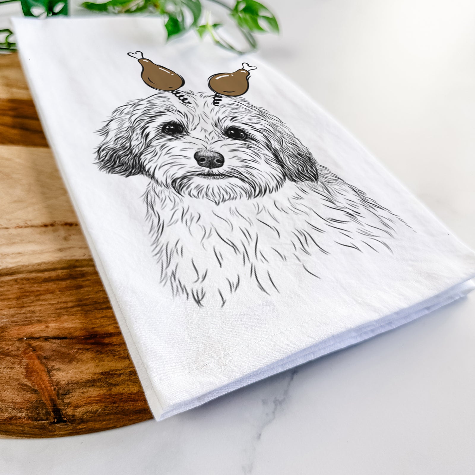 Hand-drawn sketch of Henry the Havanese with a Thanksgiving turkey headpiece on a tea towel