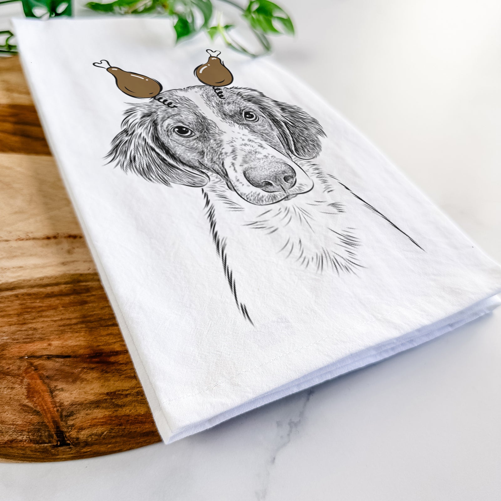Hand-drawn sketch of Holly the Brittany Spaniel with a Thanksgiving turkey headpiece on a tea towel