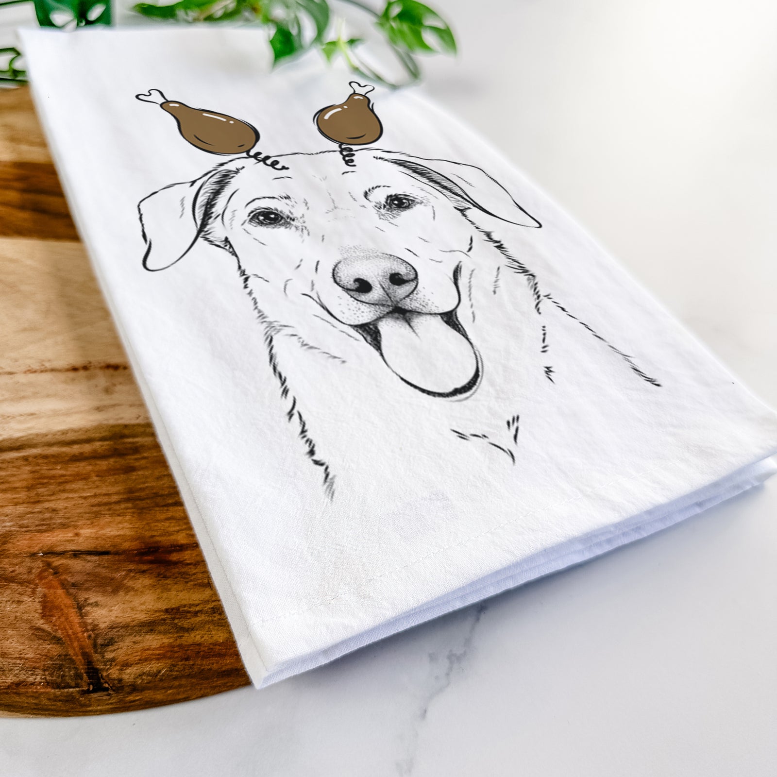 Hand-drawn sketch of Hudson the Shepherd with a Thanksgiving turkey headpiece on a tea towel