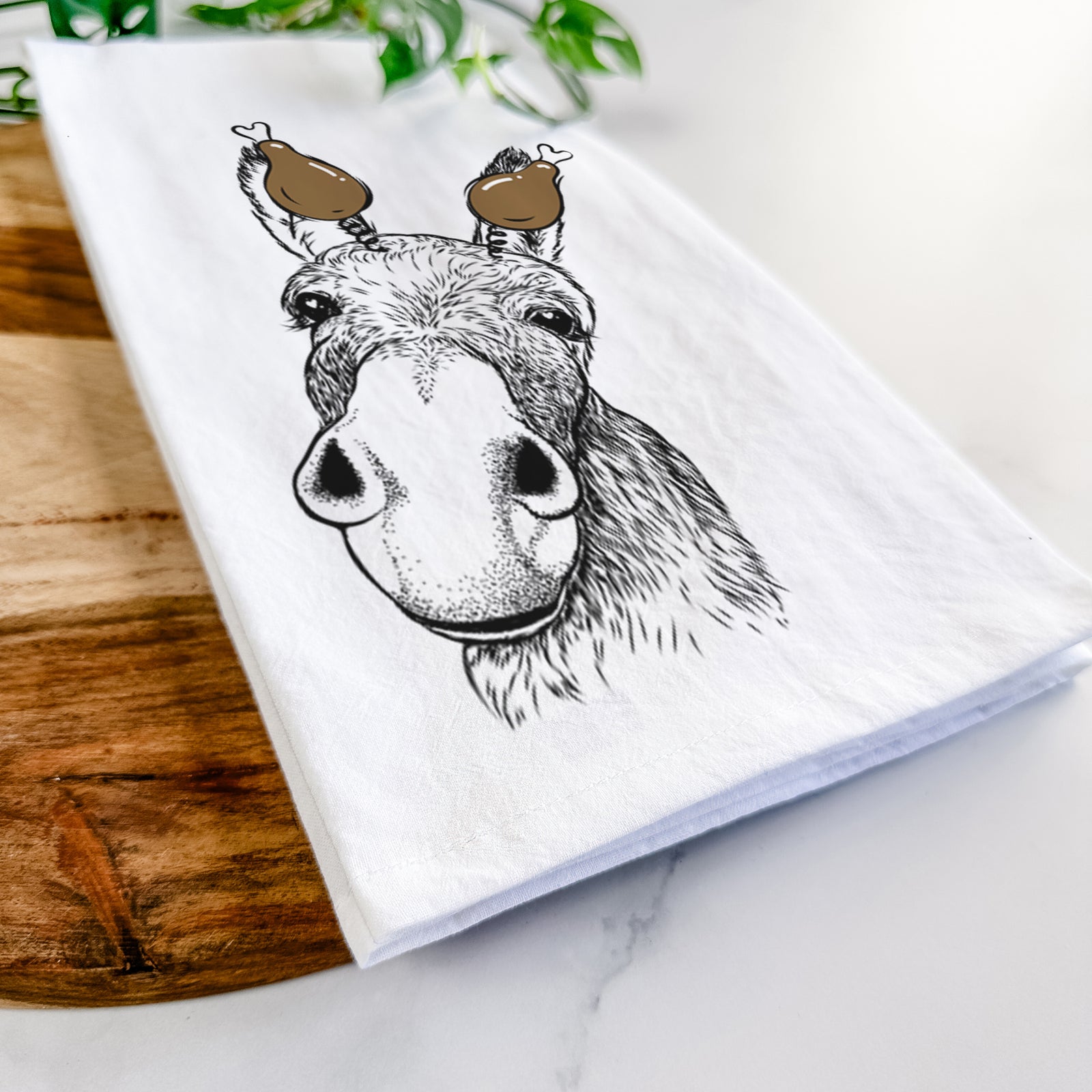 Hand-drawn sketch of Jenny the Donkey with a Thanksgiving turkey headpiece on a tea towel