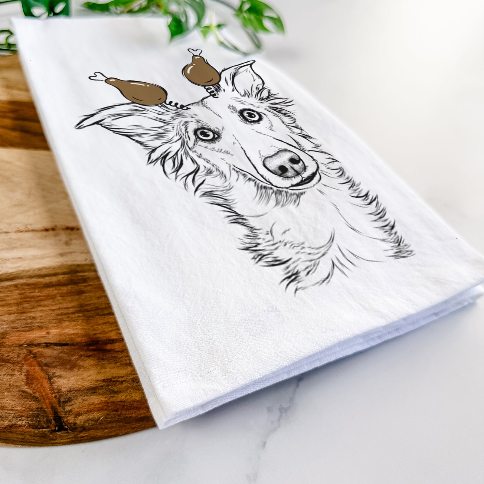 Hand-drawn sketch of Kyu the Windsprite with a Thanksgiving turkey headpiece on a tea towel