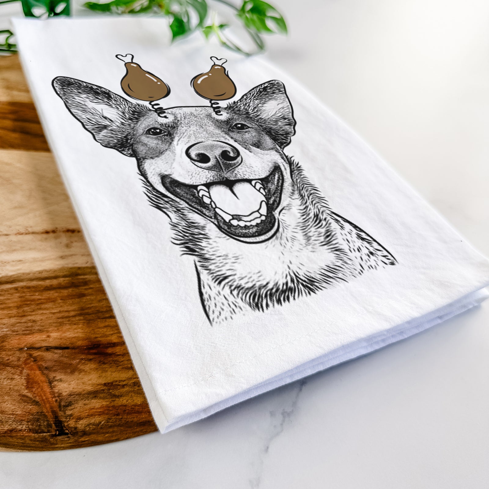 Hand-drawn sketch of Lily the Australian Cattle Dog with a Thanksgiving turkey headpiece on a tea towel