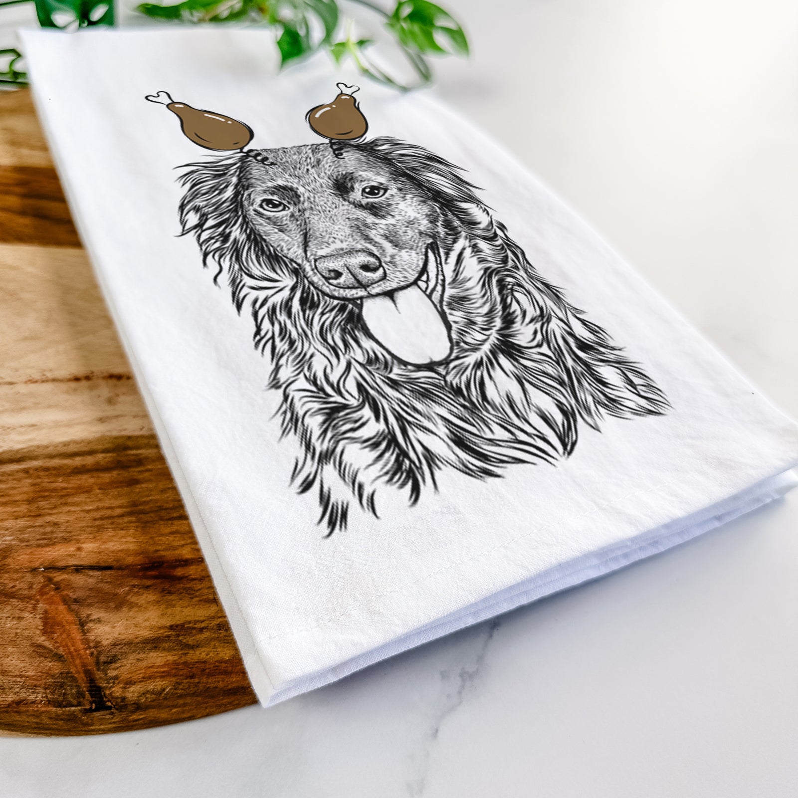 Hand-drawn sketch of Maisie Mae the Aussiedor with a Thanksgiving turkey headpiece on a tea towel