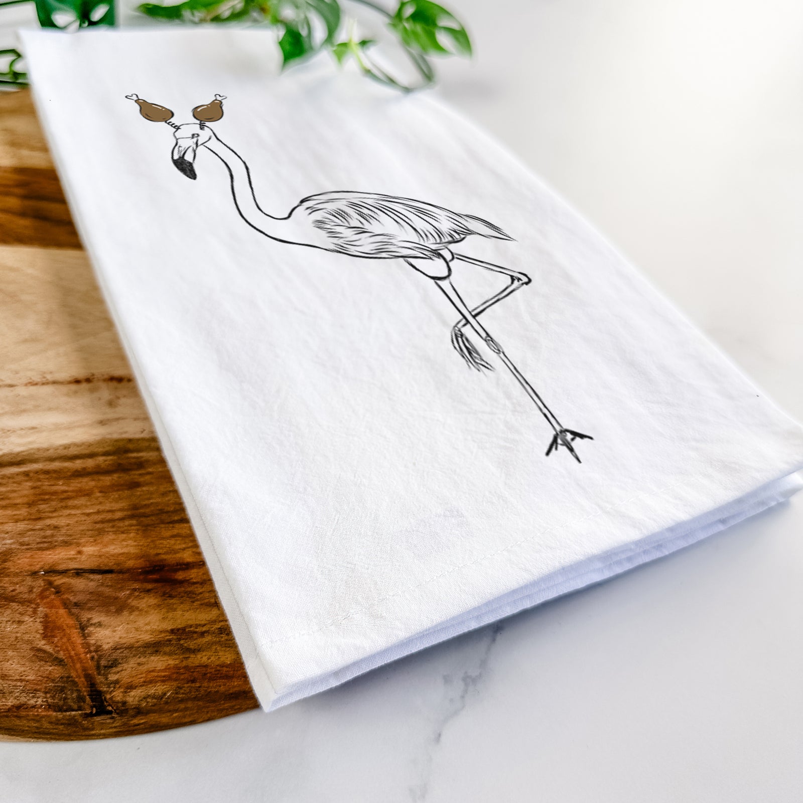 Hand-drawn sketch of Mango the Flamingo with a Thanksgiving turkey headpiece on a tea towel