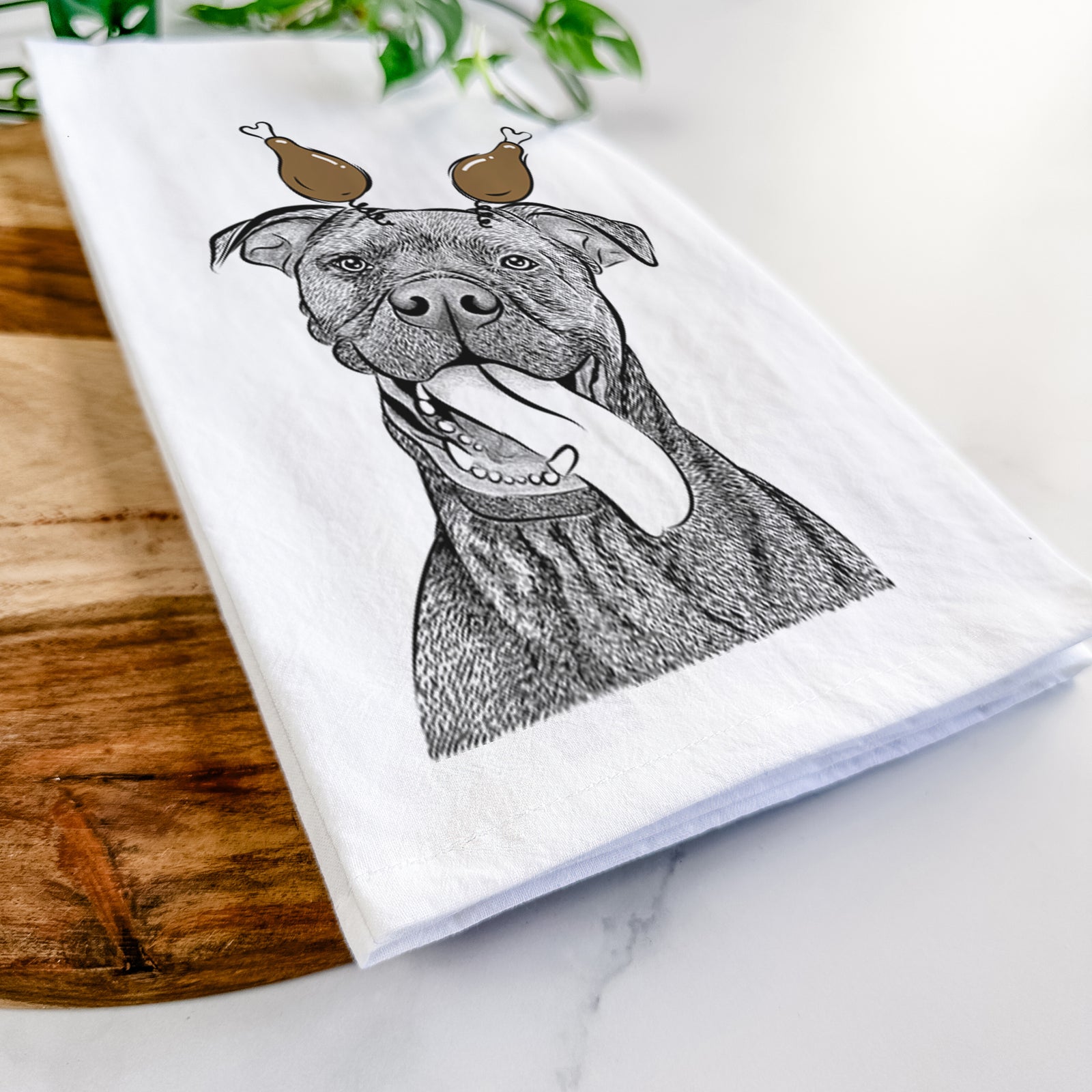 Hand-drawn sketch of Mikey the Boxador with a Thanksgiving turkey headpiece on a tea towel