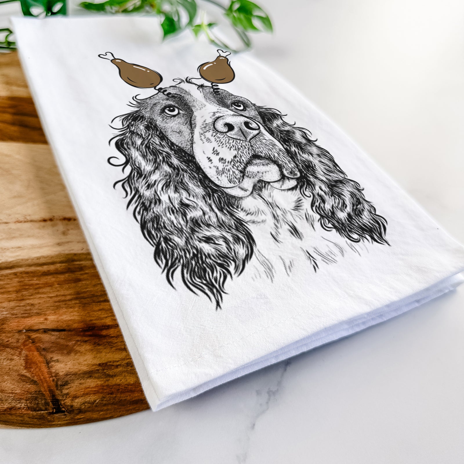 Hand-drawn sketch of Millie Mae the English Springer Spaniel with a Thanksgiving turkey headpiece on a tea towel