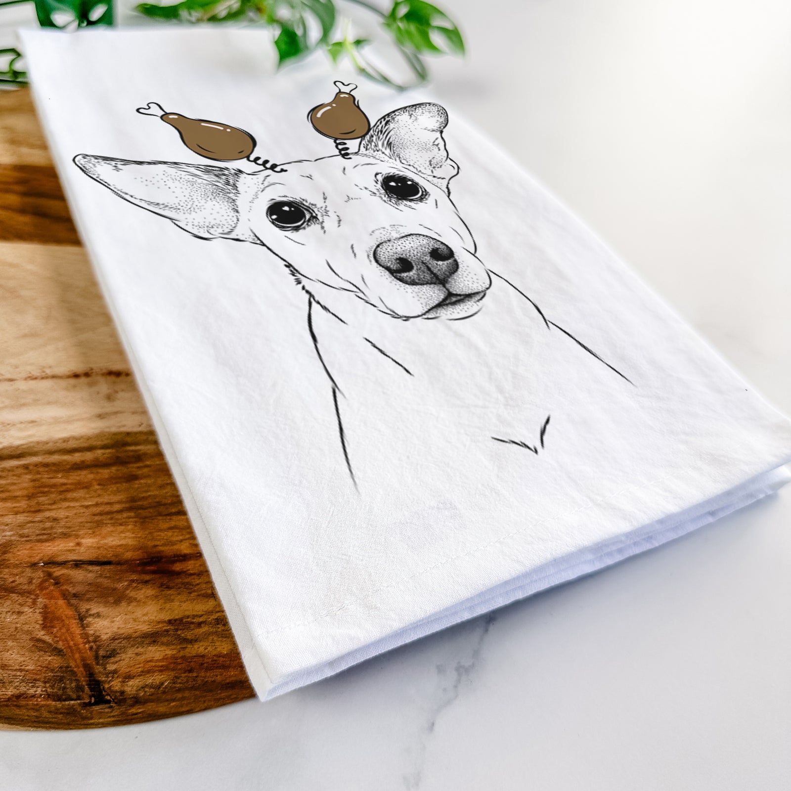 Hand-drawn sketch of Molly the Jack Russell Terrier with a Thanksgiving turkey headpiece on a tea towel