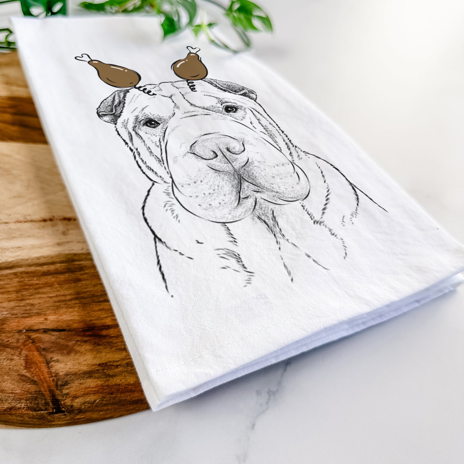Hand-drawn sketch of Moomers the Shar Pei with a Thanksgiving turkey headpiece on a tea towel