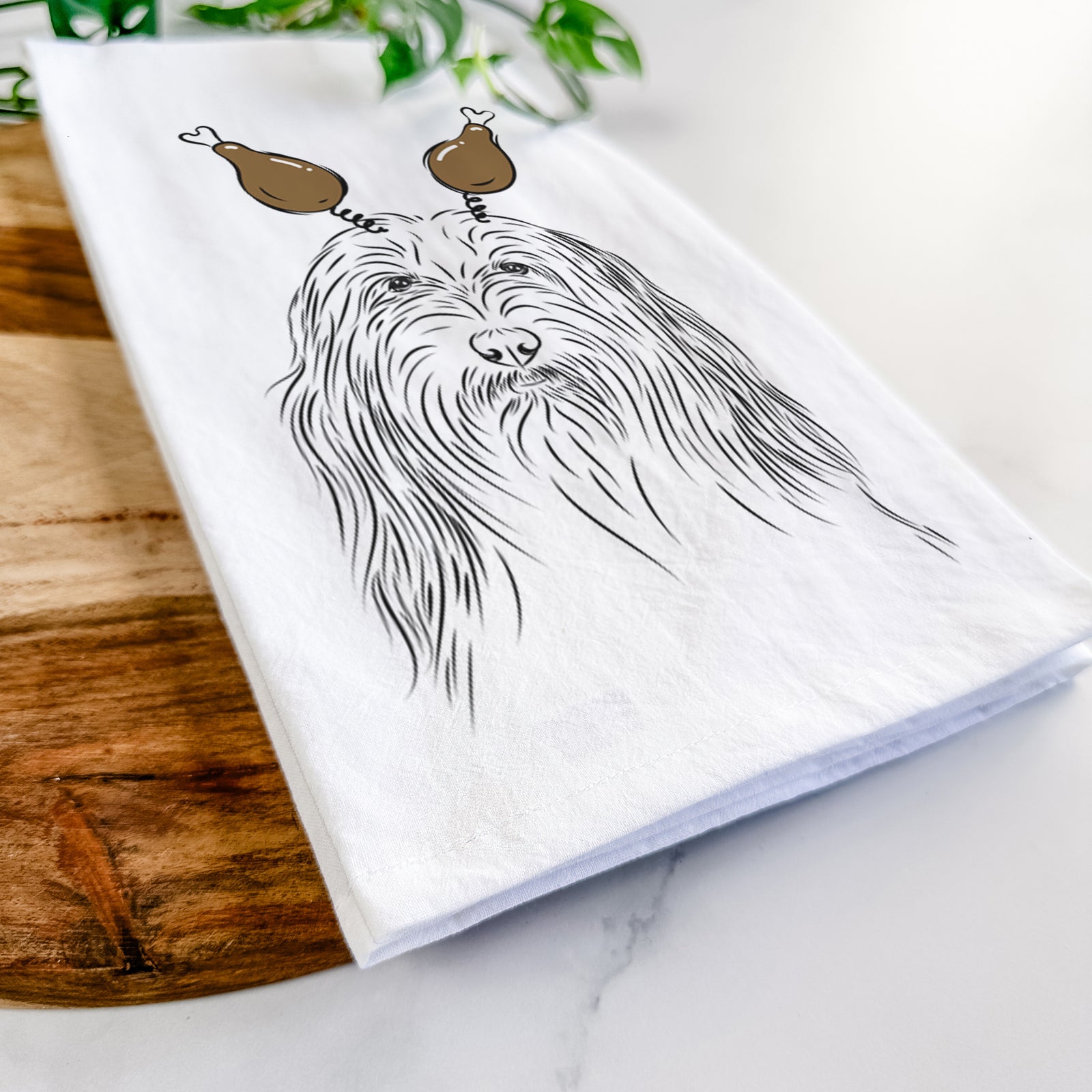 Hand-drawn sketch of Murray the Bearded Collie with a Thanksgiving turkey headpiece on a tea towel
