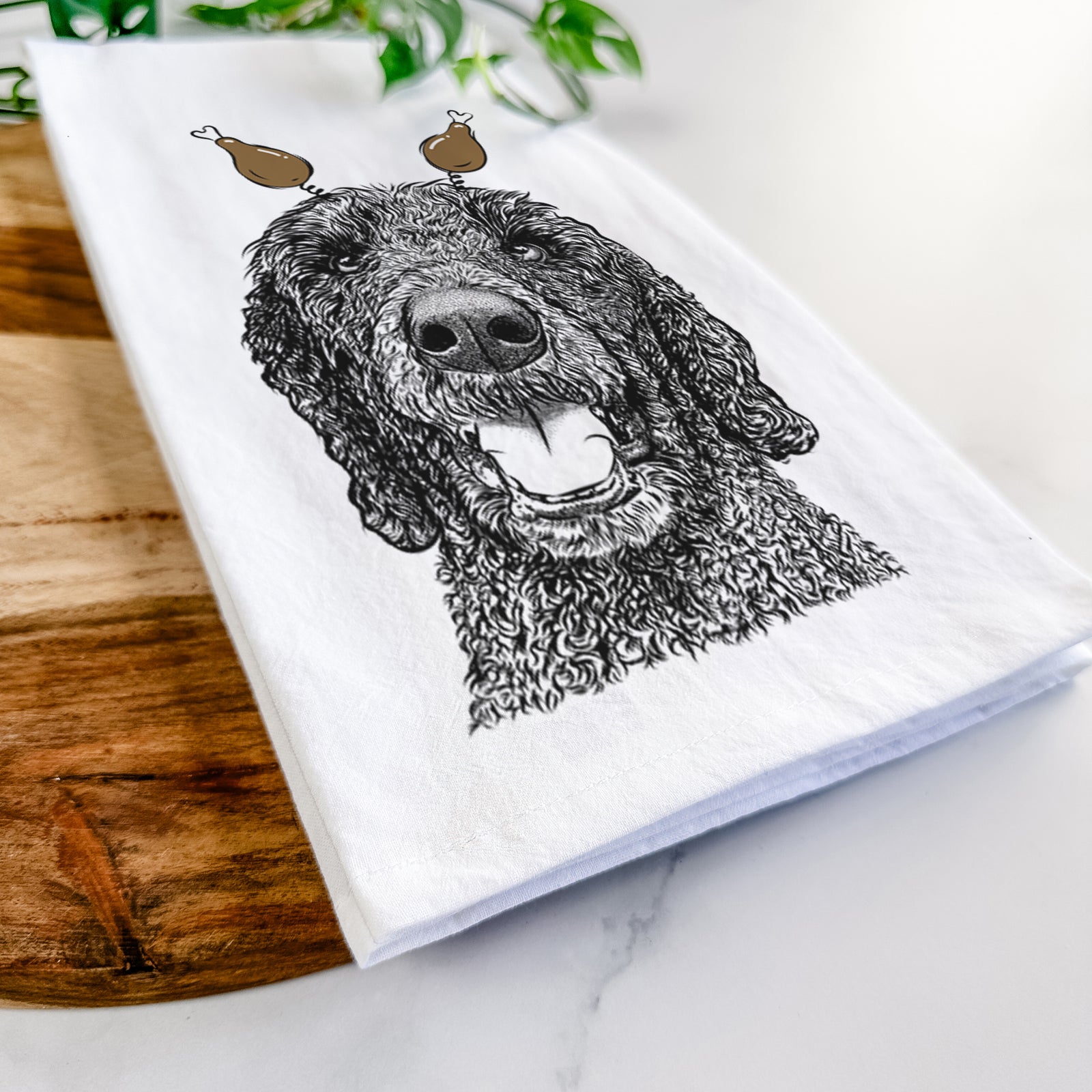 Hand-drawn sketch of Obi James the Goldendoodle with a Thanksgiving turkey headpiece on a tea towel