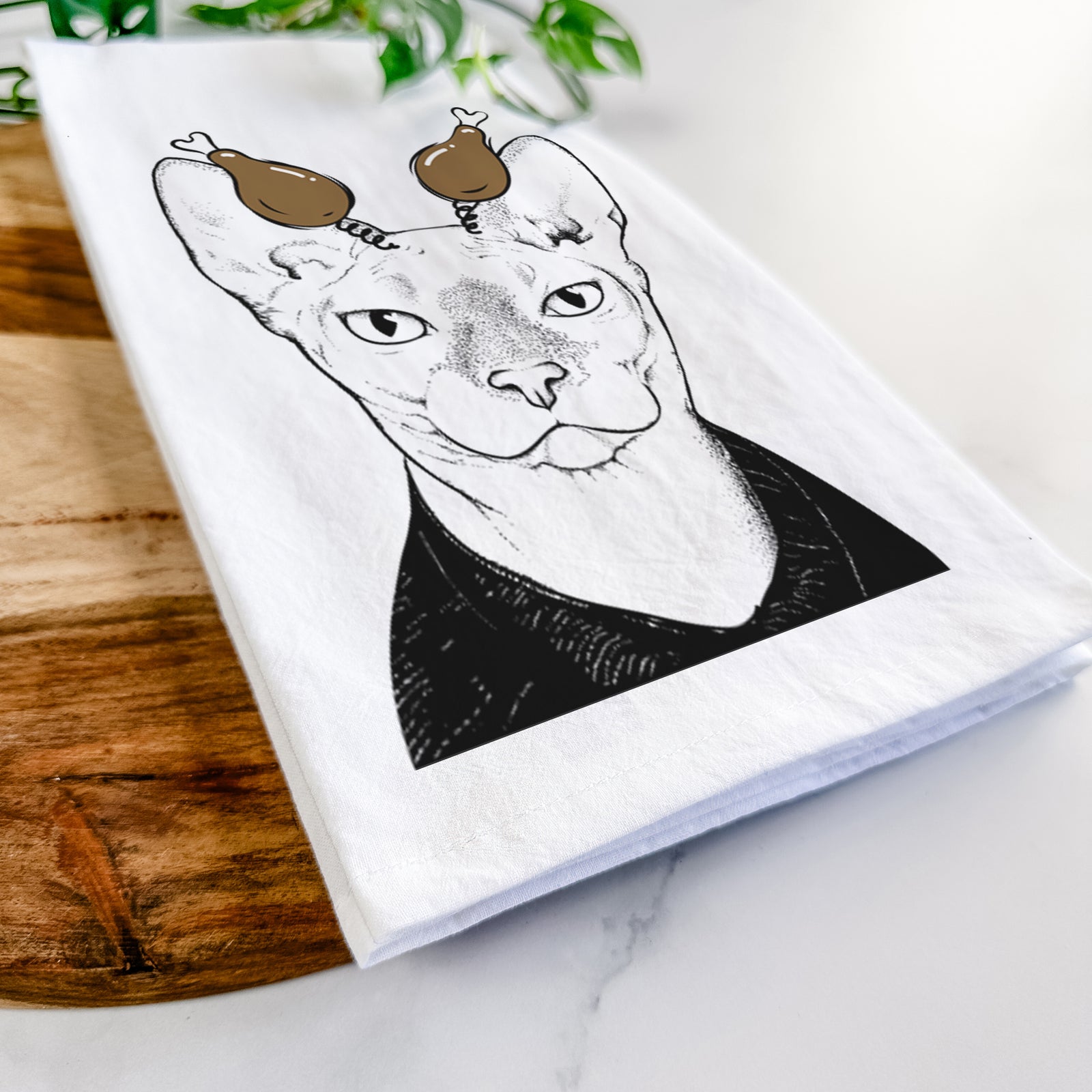 Hand-drawn sketch of Oliver Watson the Sphynx Cat with a Thanksgiving turkey headpiece on a tea towel