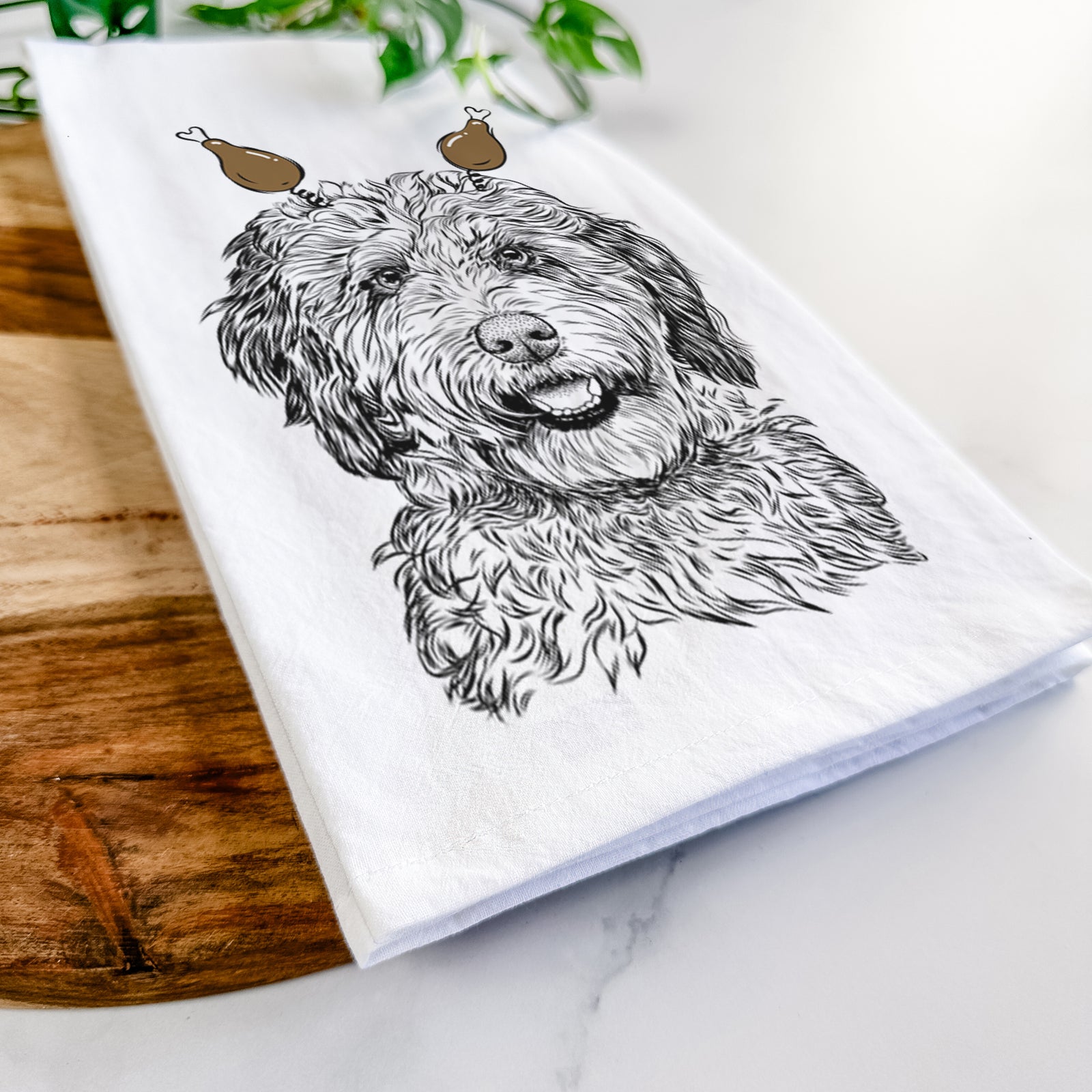 Hand-drawn sketch of Palmer the Aussiedoodle with a Thanksgiving turkey headpiece on a tea towel