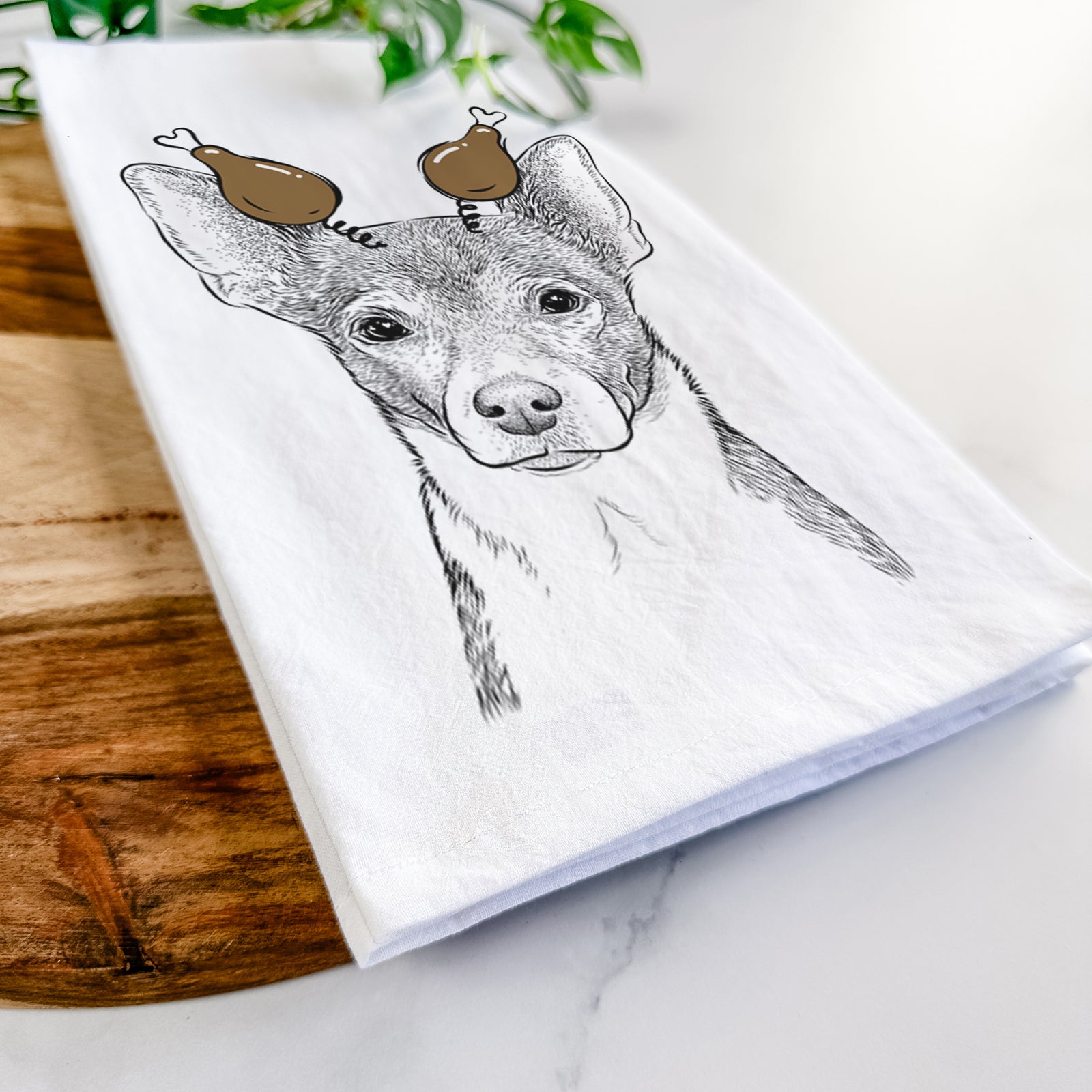 Hand-drawn sketch of Peanut the Chihuahua with a Thanksgiving turkey headpiece on a tea towel