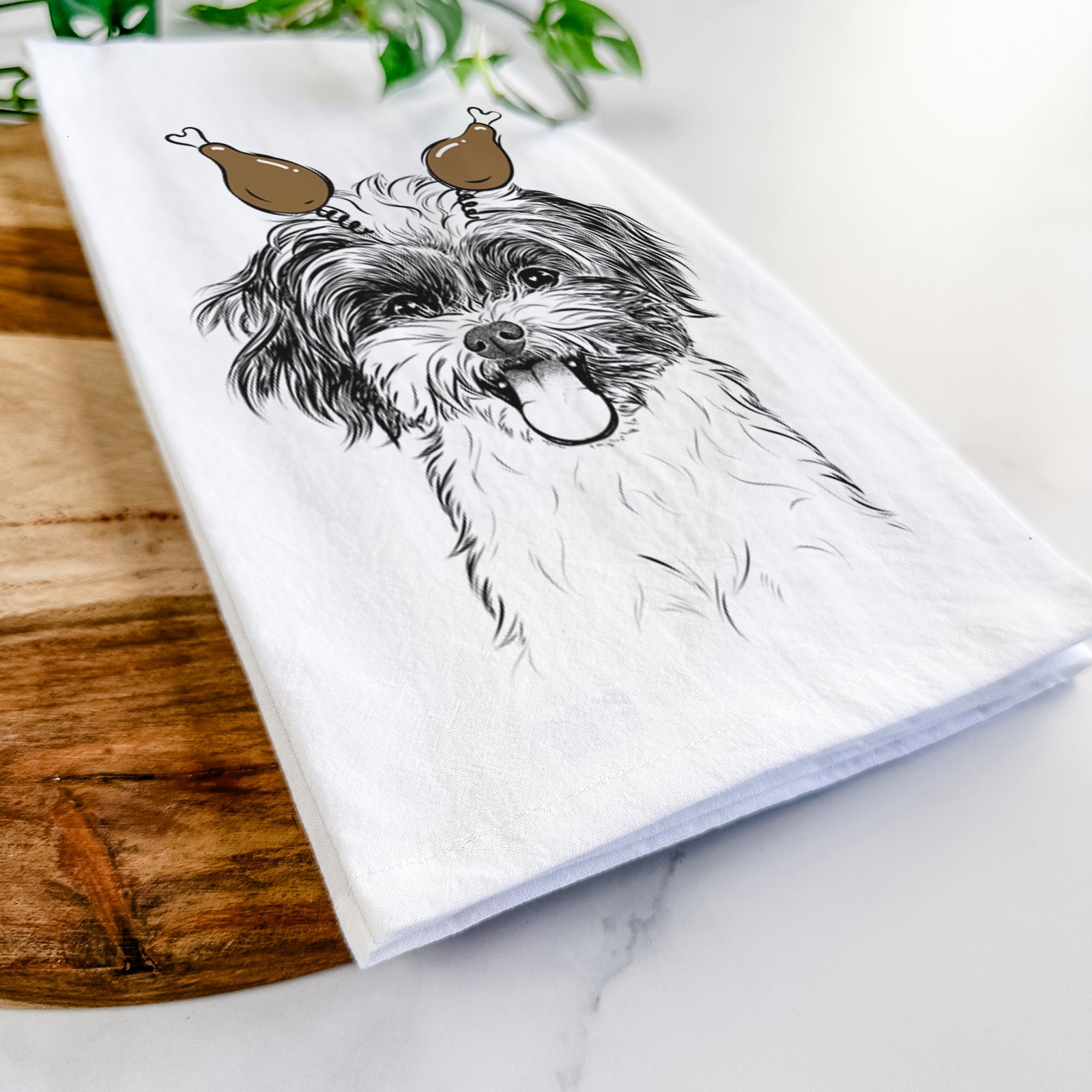 Hand-drawn sketch of Pepper the Shihpoo with a Thanksgiving turkey headpiece on a tea towel