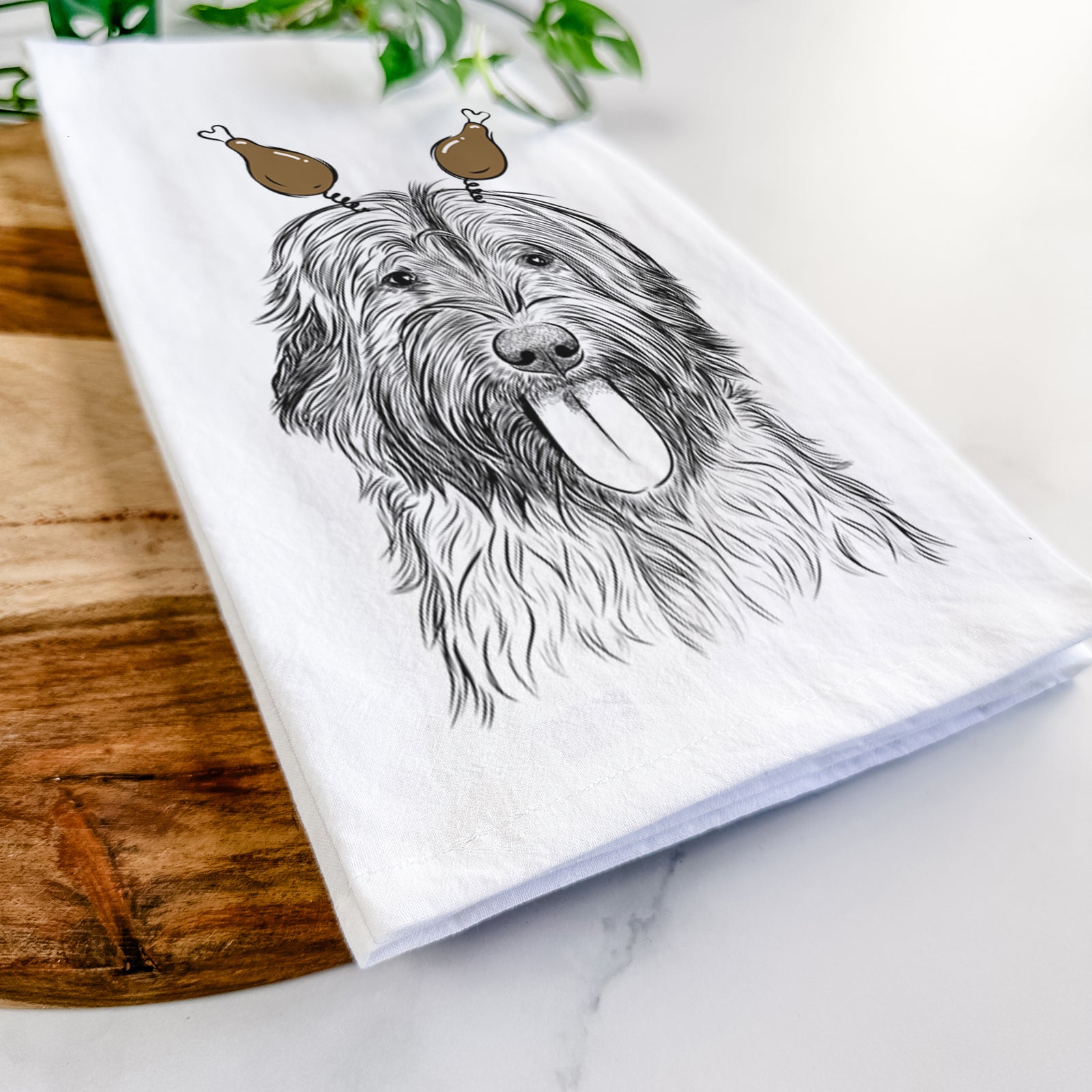 Hand-drawn sketch of Puig the Catalan Sheepdog with a Thanksgiving turkey headpiece on a tea towel