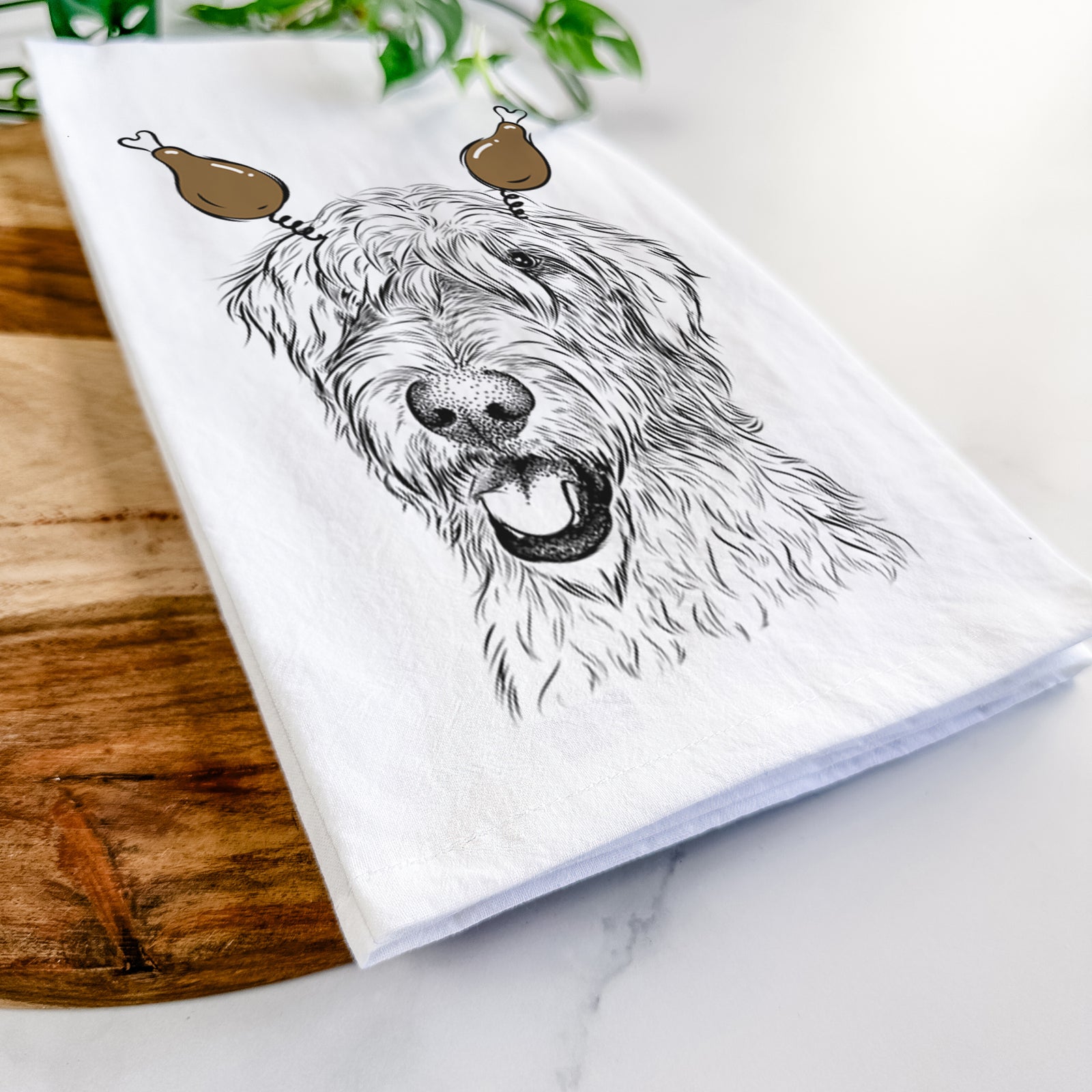 Hand-drawn sketch of Ragnar the Irish Wolfhound with a Thanksgiving turkey headpiece on a tea towel