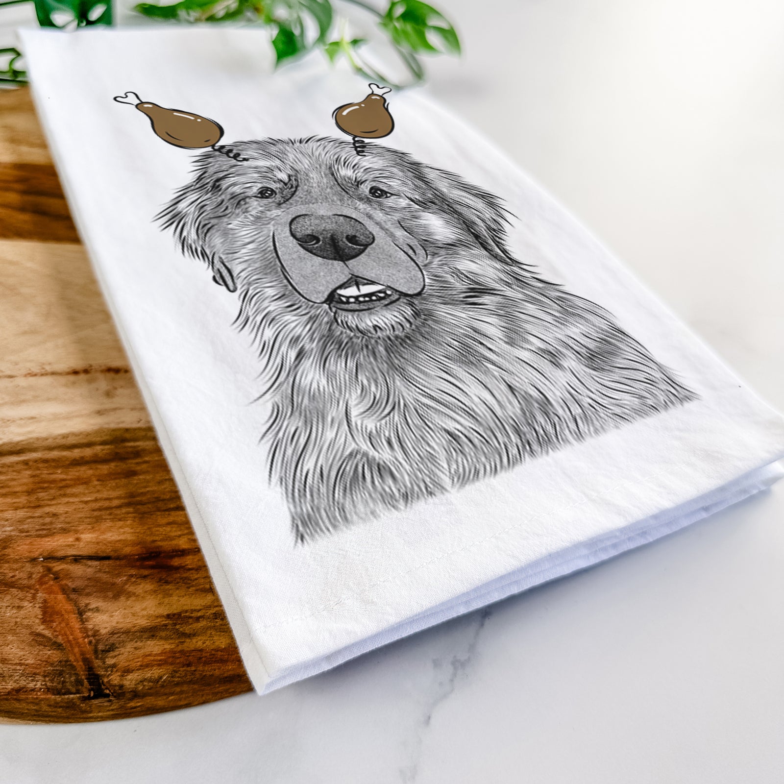 Hand-drawn sketch of Ralph the Leonberger with a Thanksgiving turkey headpiece on a tea towel