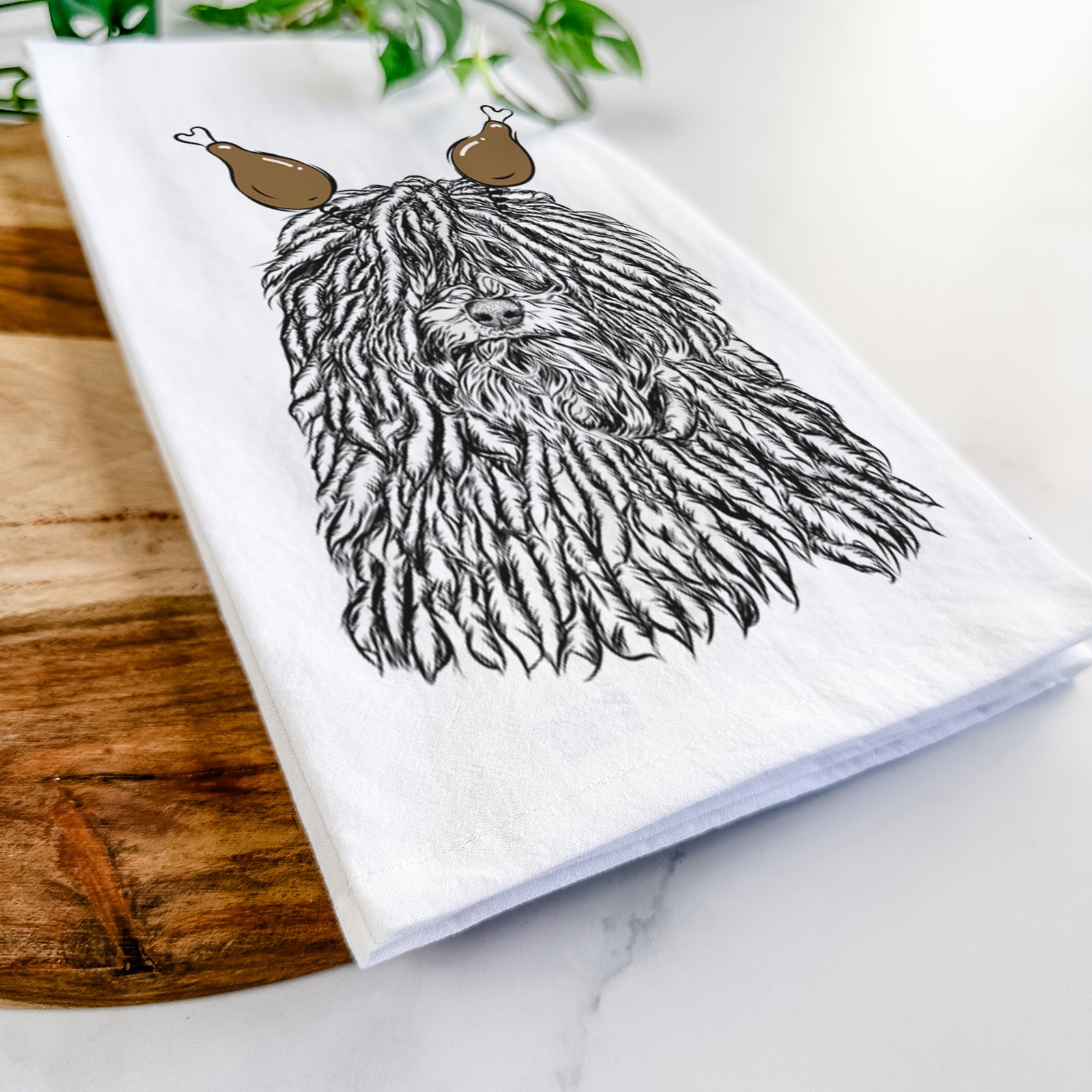 Hand-drawn sketch of Rezi the Puli with a Thanksgiving turkey headpiece on a tea towel
