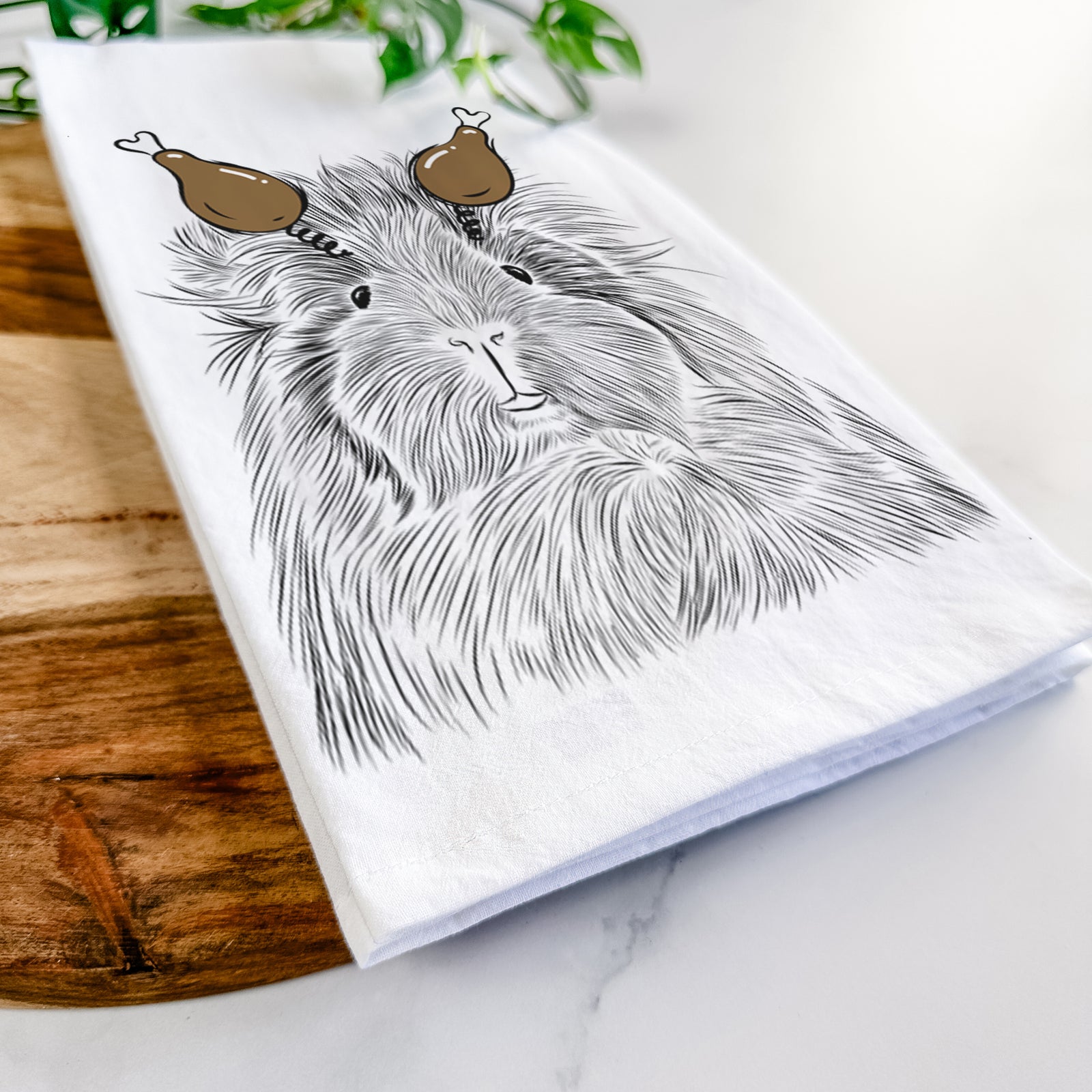 Hand-drawn sketch of Rhino the Guinea Pig with a Thanksgiving turkey headpiece on a tea towel