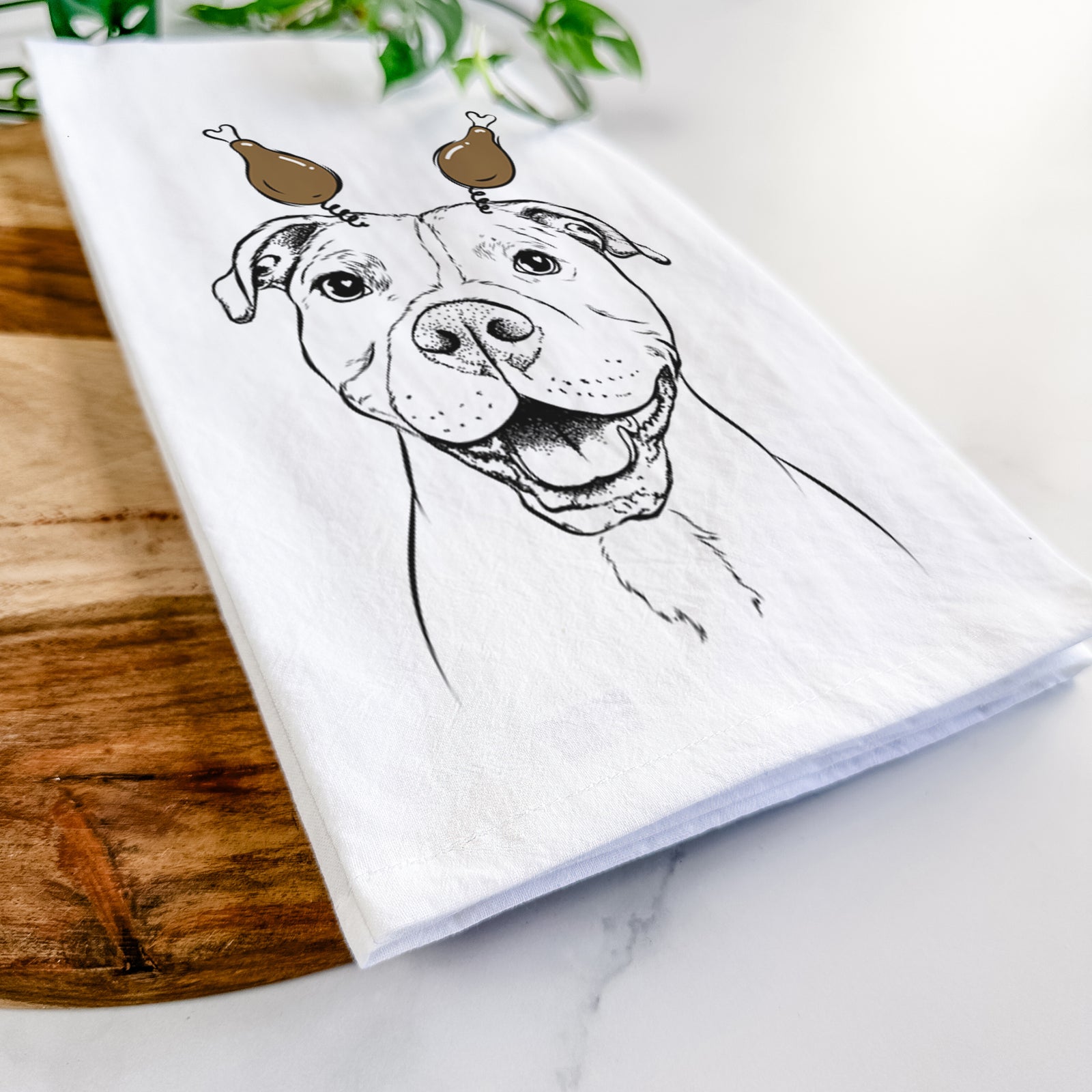 Hand-drawn sketch of Roscoe the Pitbull with a Thanksgiving turkey headpiece on a tea towel