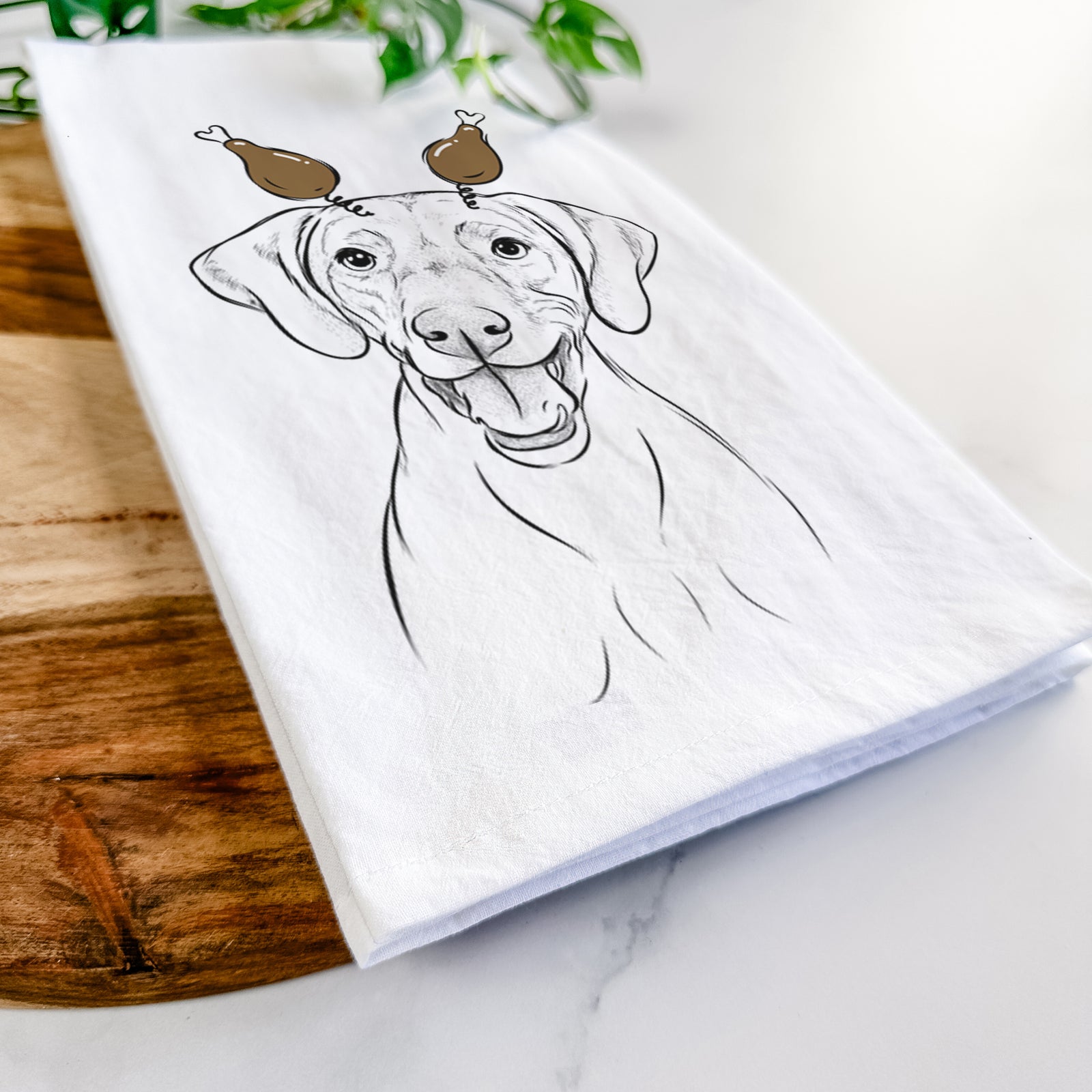 Hand-drawn sketch of Ruby the Vizsla with a Thanksgiving turkey headpiece on a tea towel