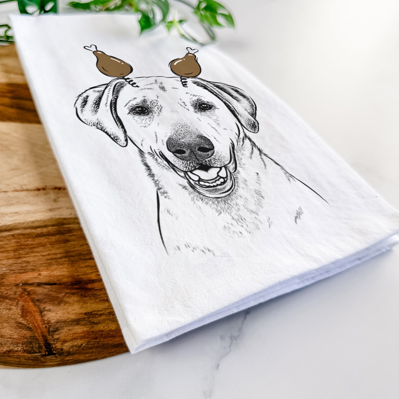 Hand-drawn sketch of Rusty the Labrador Retriever with a Thanksgiving turkey headpiece on a tea towel