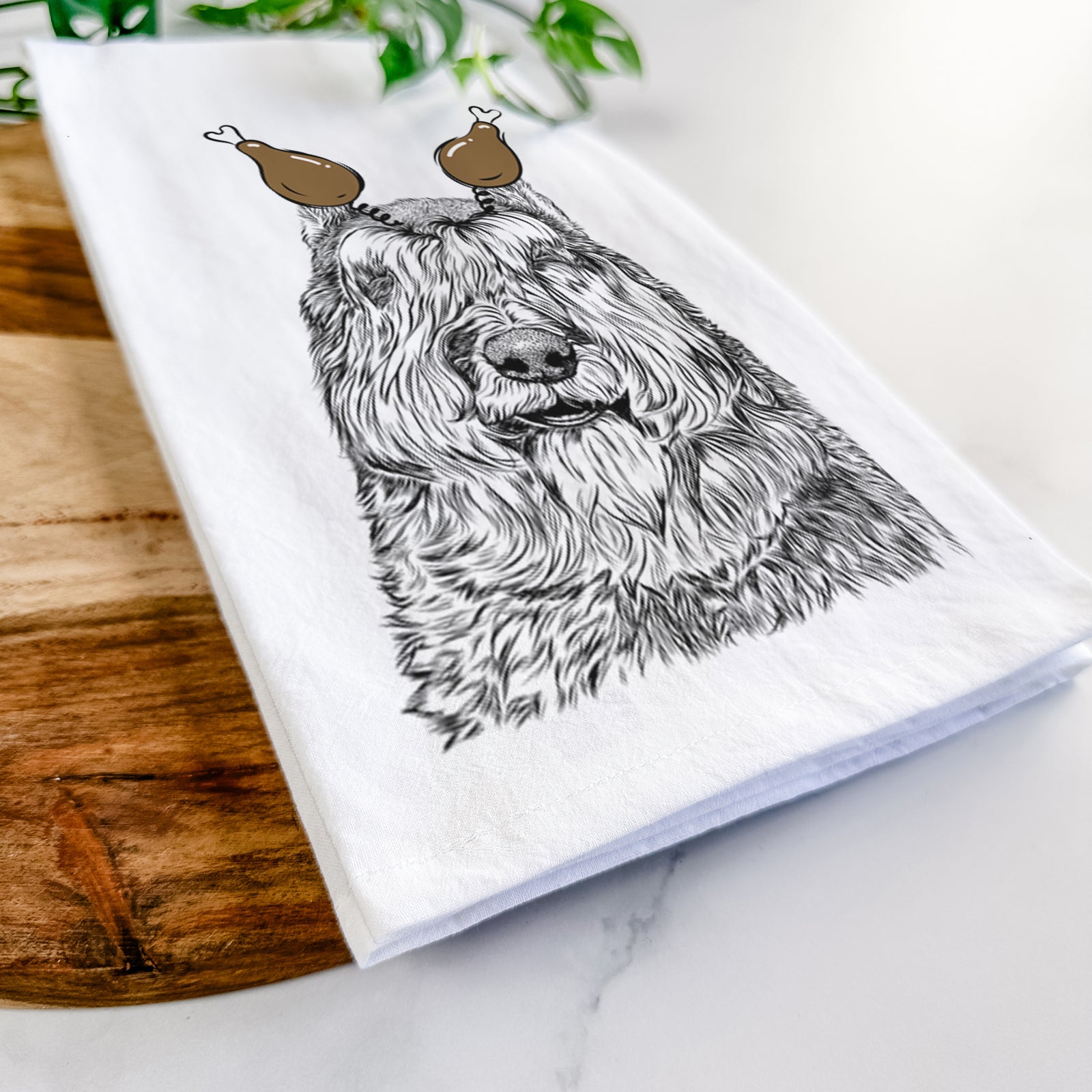 Hand-drawn sketch of Sabre the Bouvier Des Flandres with a Thanksgiving turkey headpiece on a tea towel