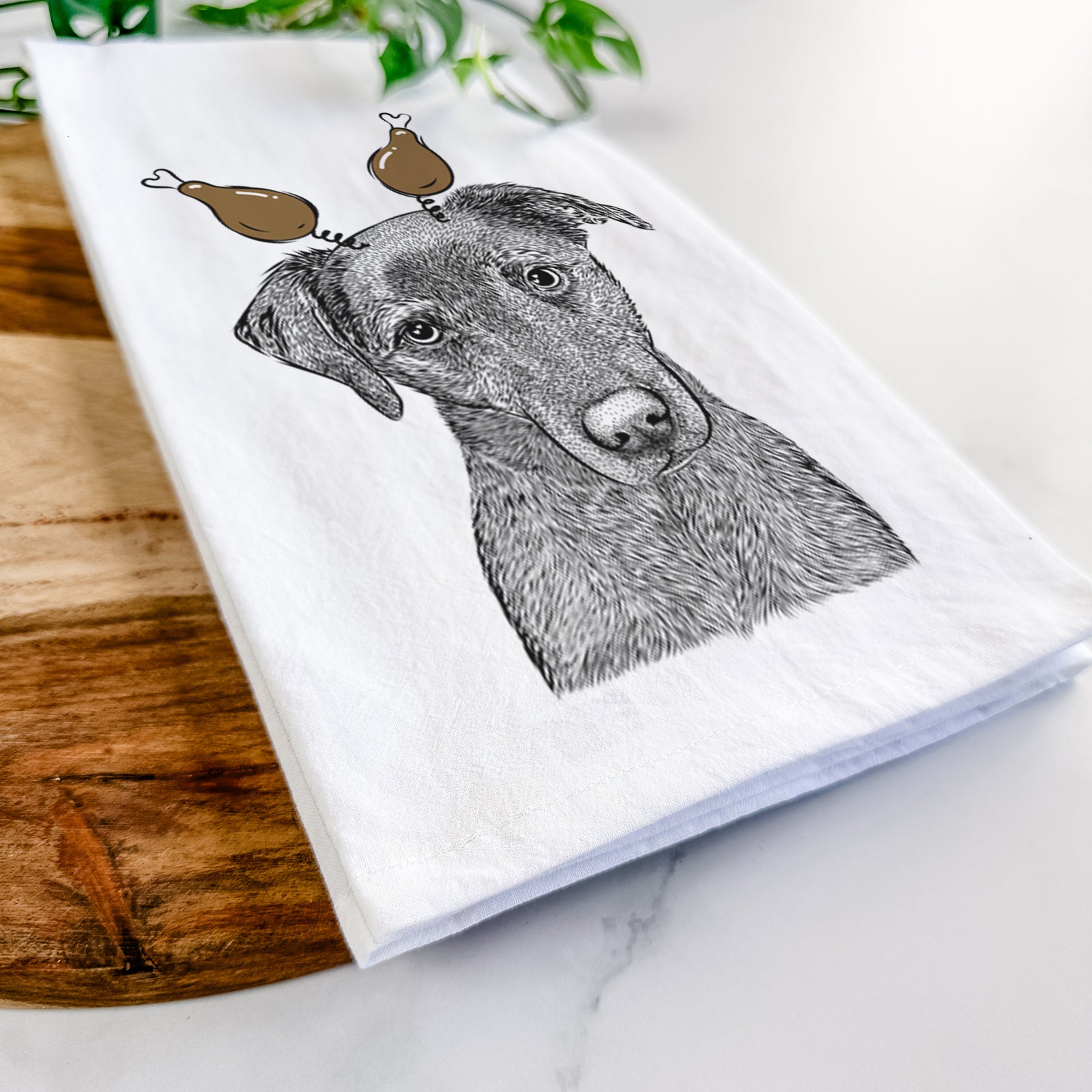 Hand-drawn sketch of Sadie the Whipador with a Thanksgiving turkey headpiece on a tea towel