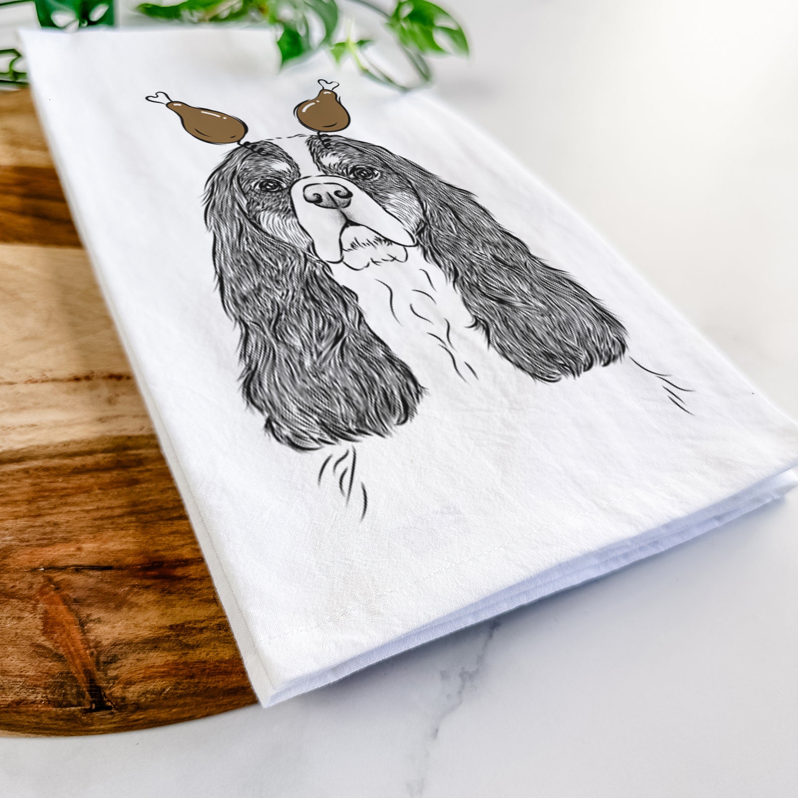 Hand-drawn sketch of Sebastian the Cavalier King Charles Spaniel with a Thanksgiving turkey headpiece on a tea towel