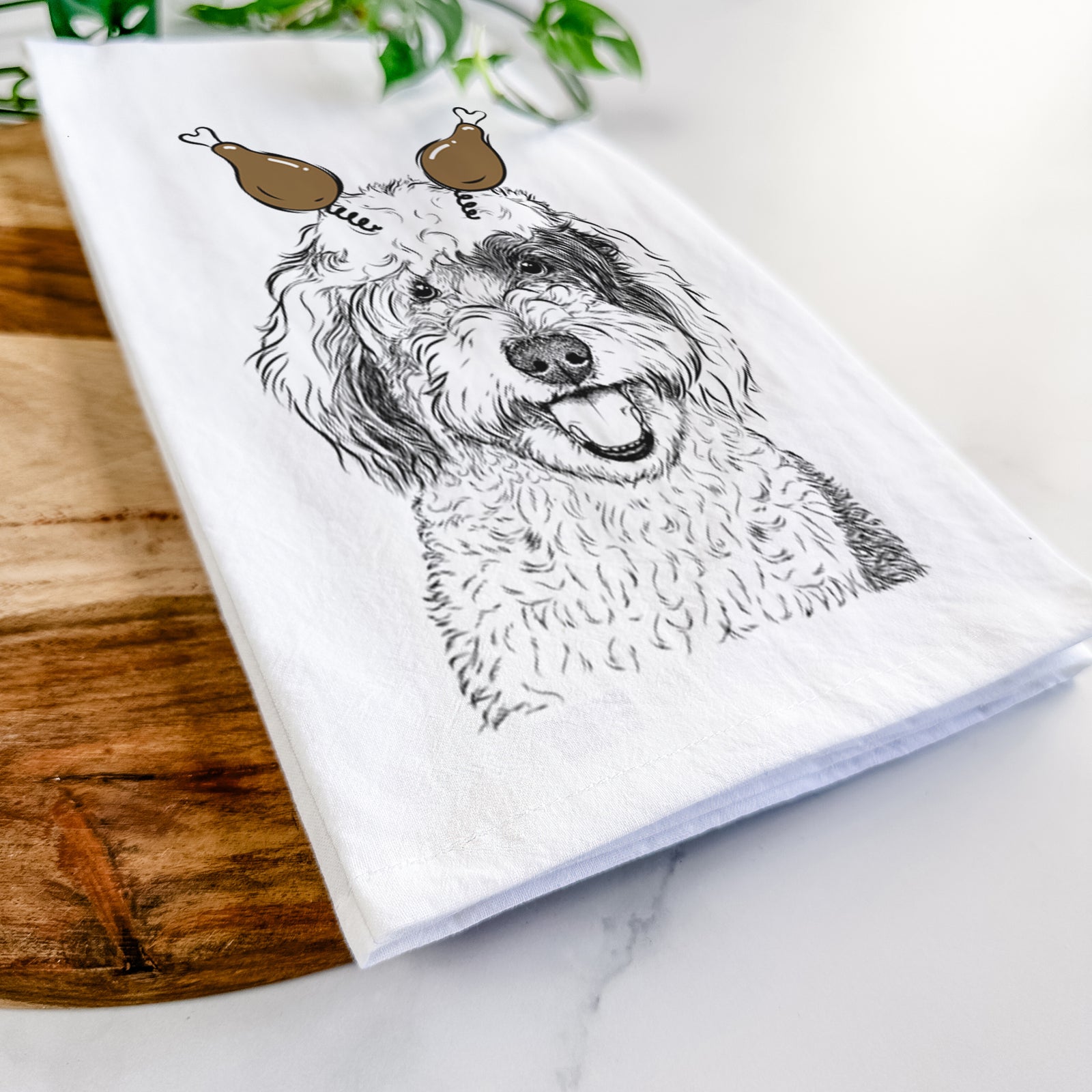 Hand-drawn sketch of Sherlock the Sheepadoodle with a Thanksgiving turkey headpiece on a tea towel