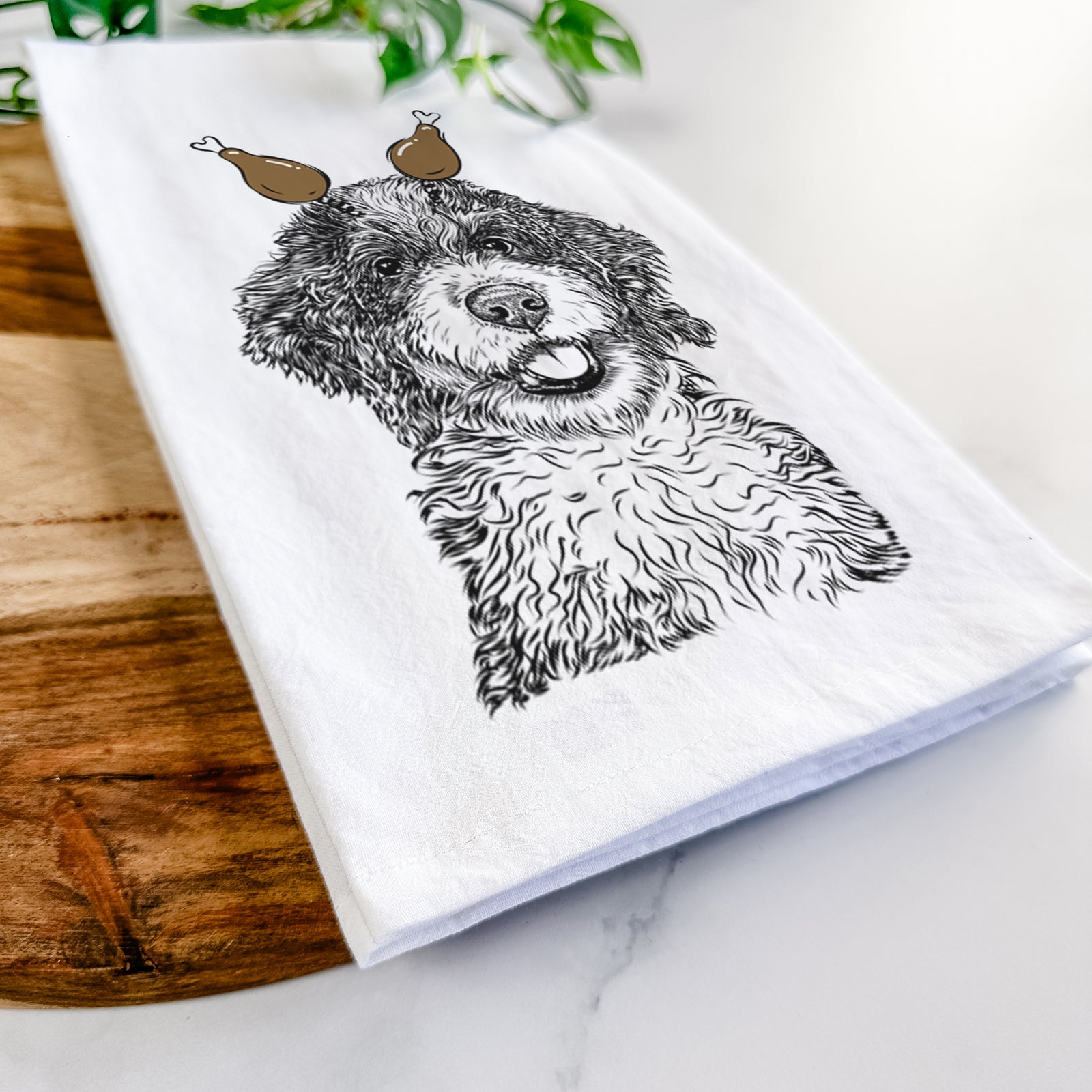 Hand-drawn sketch of Smoky the Bernedoodle Puppy with a Thanksgiving turkey headpiece on a tea towel