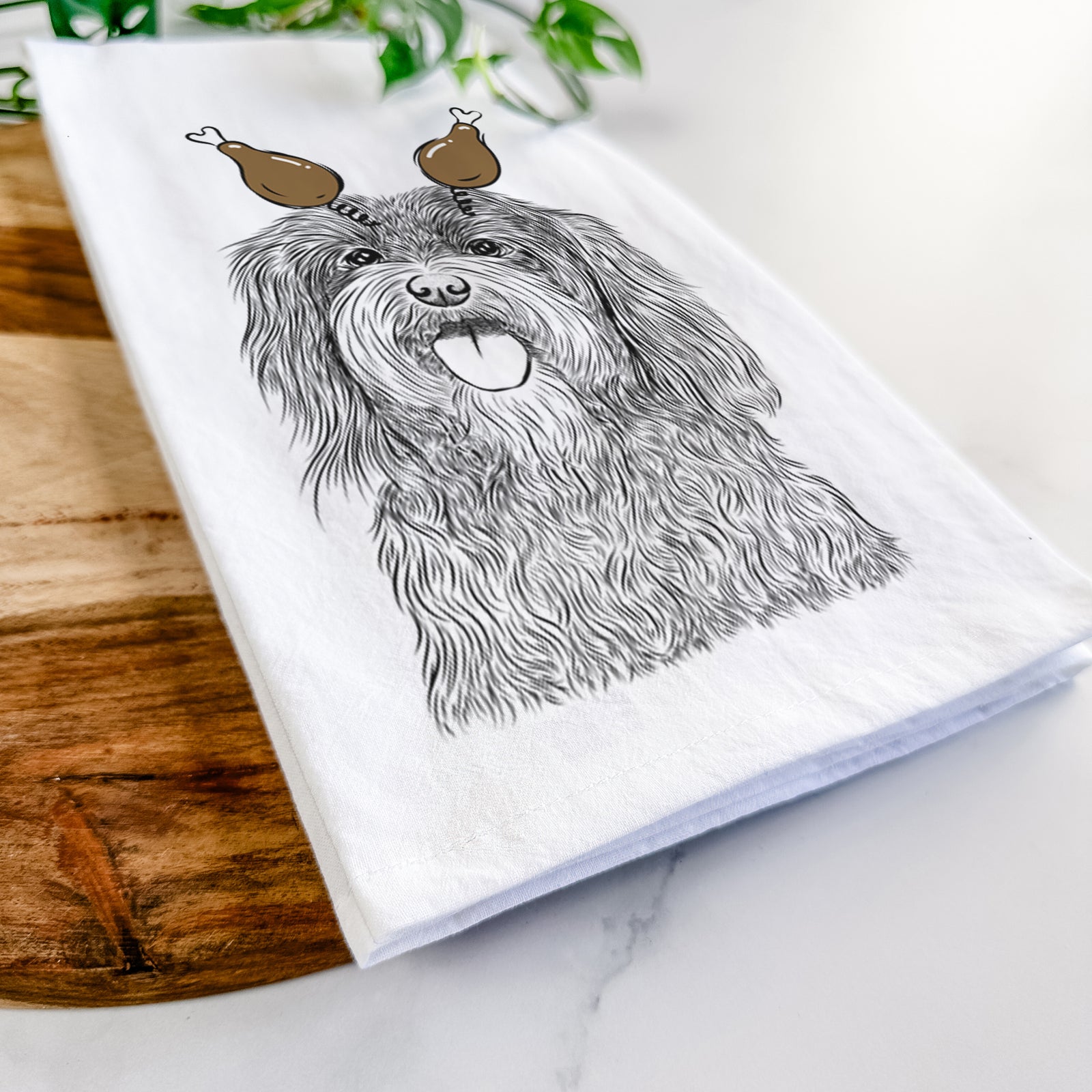 Hand-drawn sketch of Sophie the Havanese with a Thanksgiving turkey headpiece on a tea towel