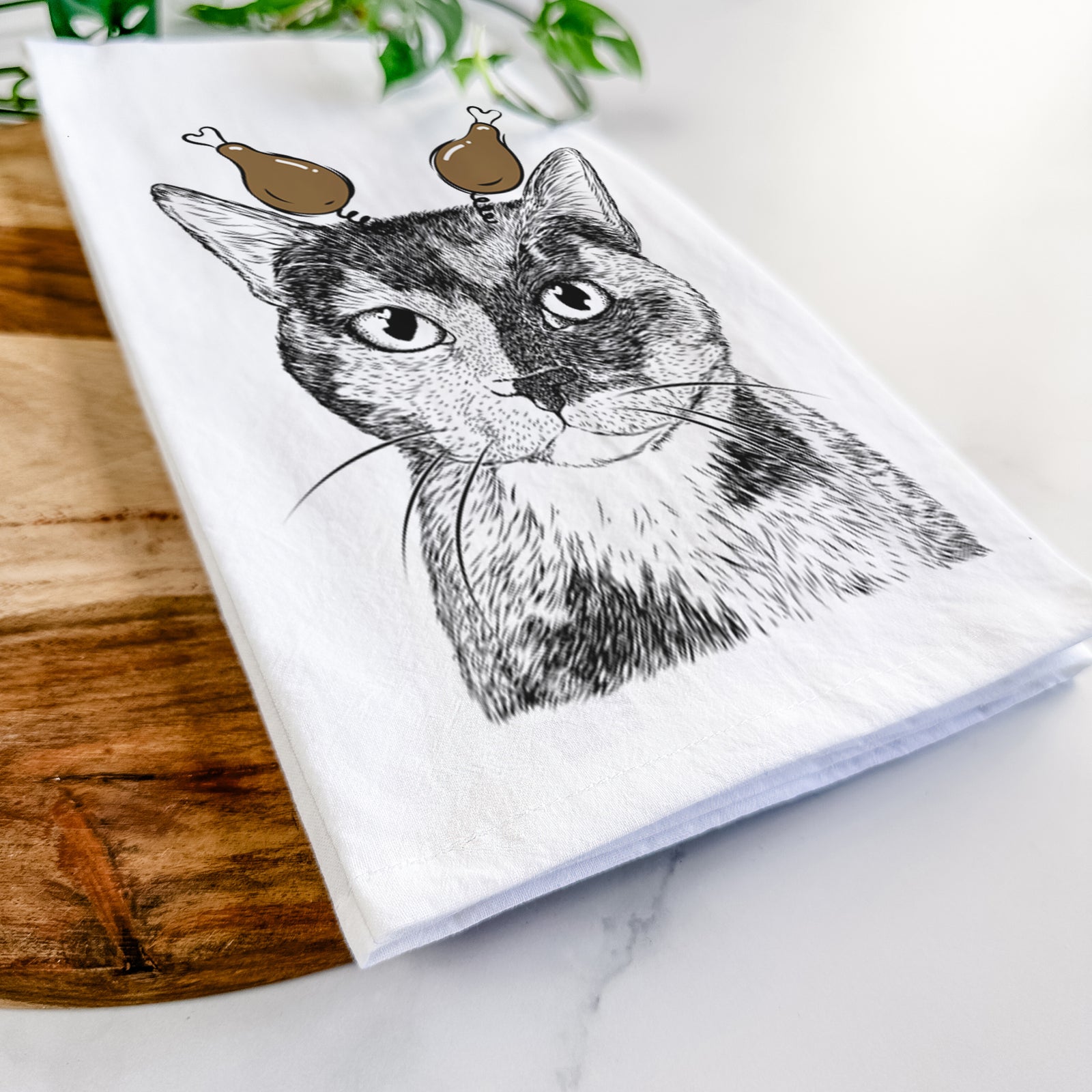Hand-drawn sketch of Spooky Kitty the Tortoiseshell Cat with a Thanksgiving turkey headpiece on a tea towel